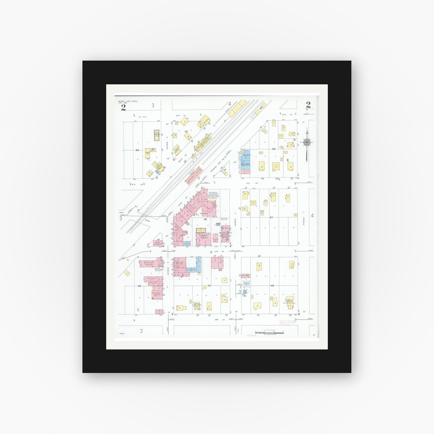Old map wall art mockup — black gallery frame with white mat — Sanborn Fire Insurance Map from Moose Lake, Carlton County, Minnesota (1951), Sheet #0002