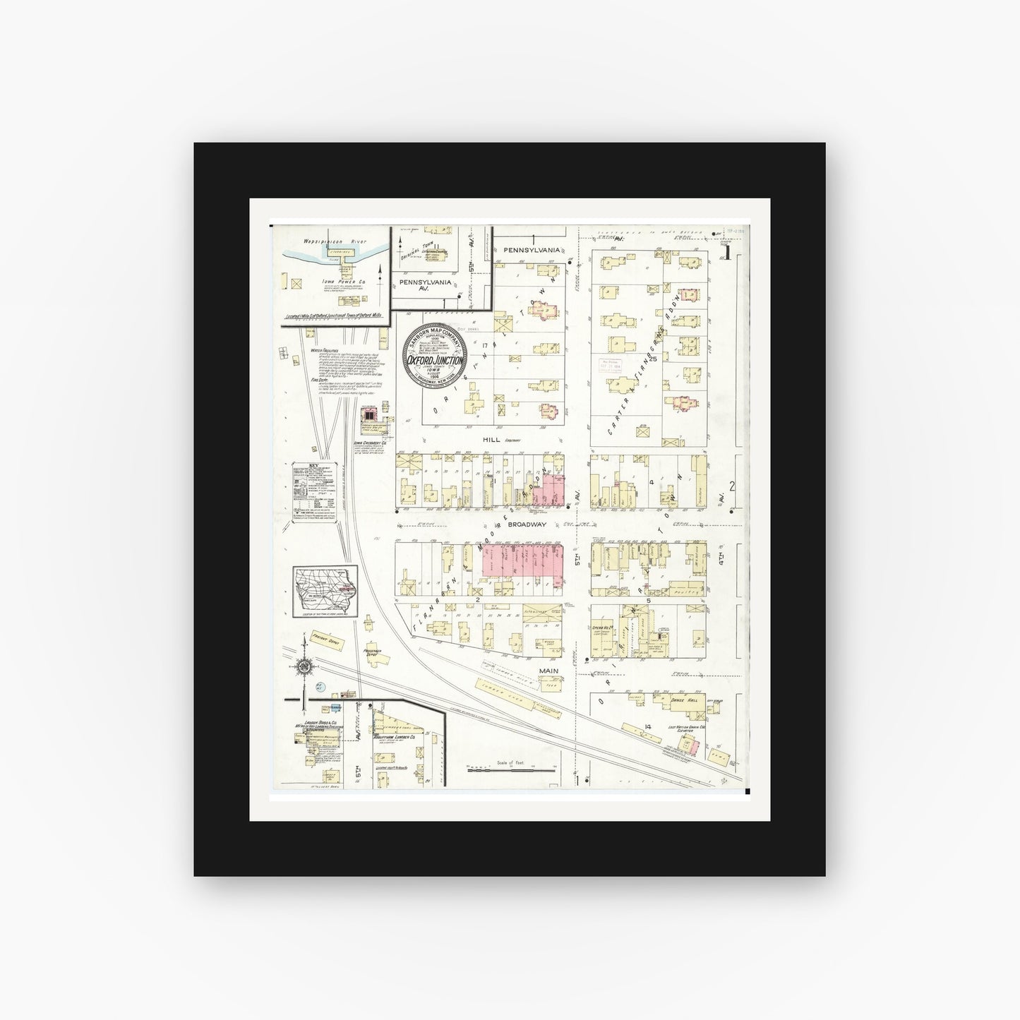 Old map wall art mockup — black gallery frame with white mat — Sanborn Fire Insurance Map from Oxford Junction, Jones County, Iowa (1914), Sheet #0001