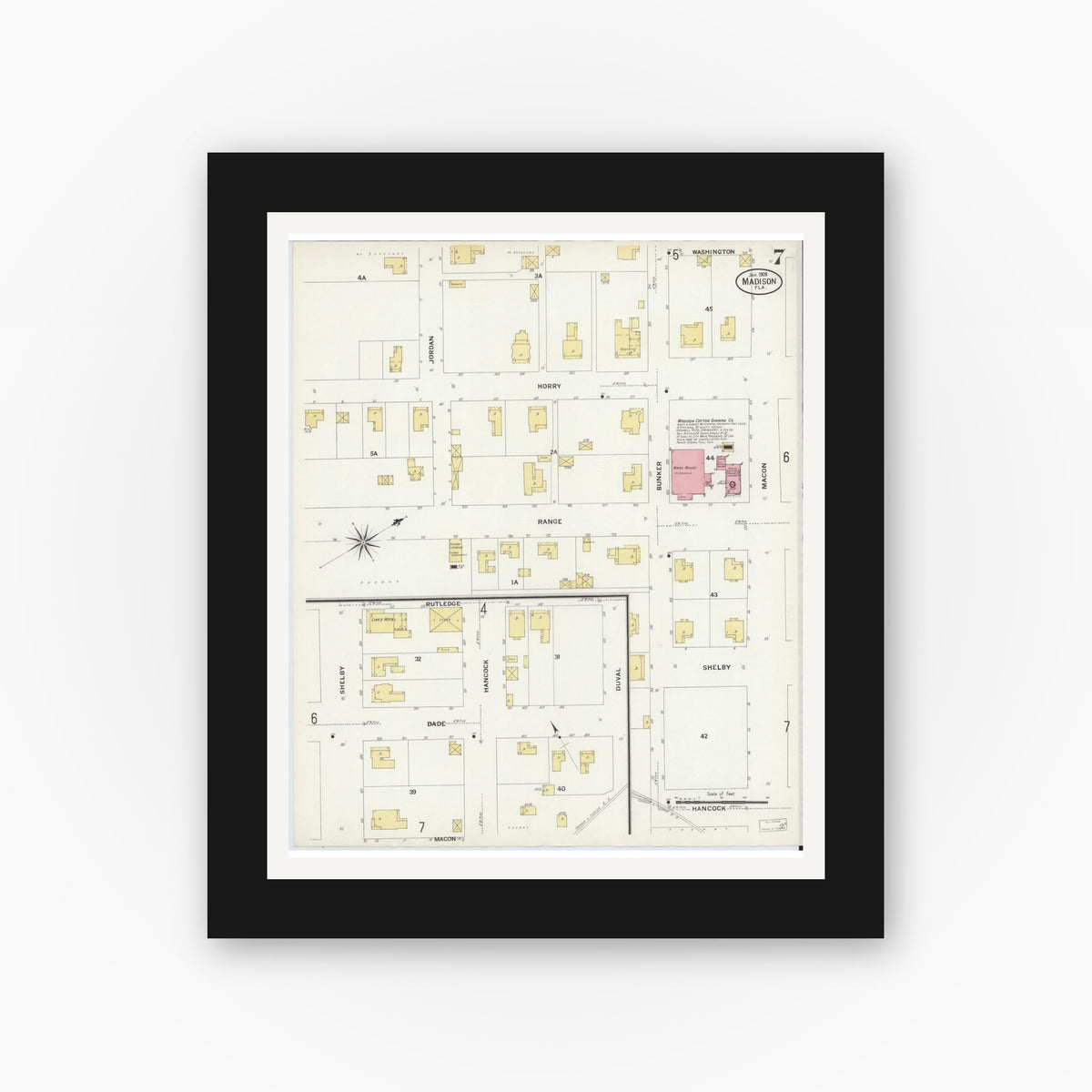 Old map wall art mockup — black gallery frame with white mat — Sanborn Fire Insurance Map from Madison, Madison County, Florida (1909), Sheet #0007