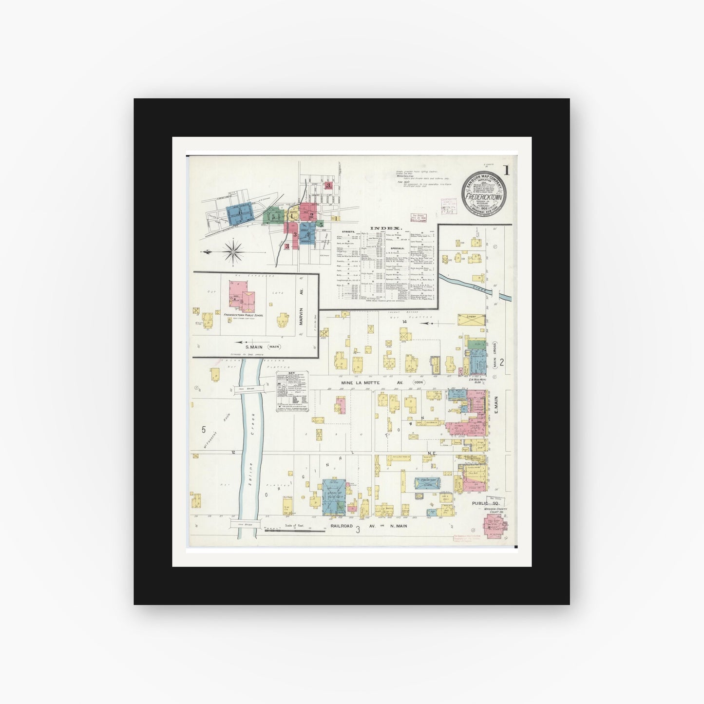Old map wall art mockup — black gallery frame with white mat — Sanborn Fire Insurance Map from Fredericktown, Madison County, Missouri (1908), Sheet #0001