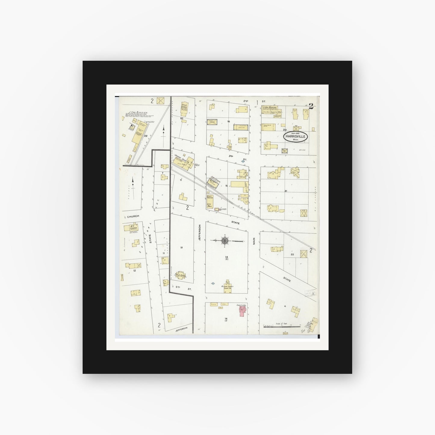 Old map wall art mockup — black gallery frame with white mat — Sanborn Fire Insurance Map from Harrisville, Alcona County, Michigan (1910), Sheet #0002