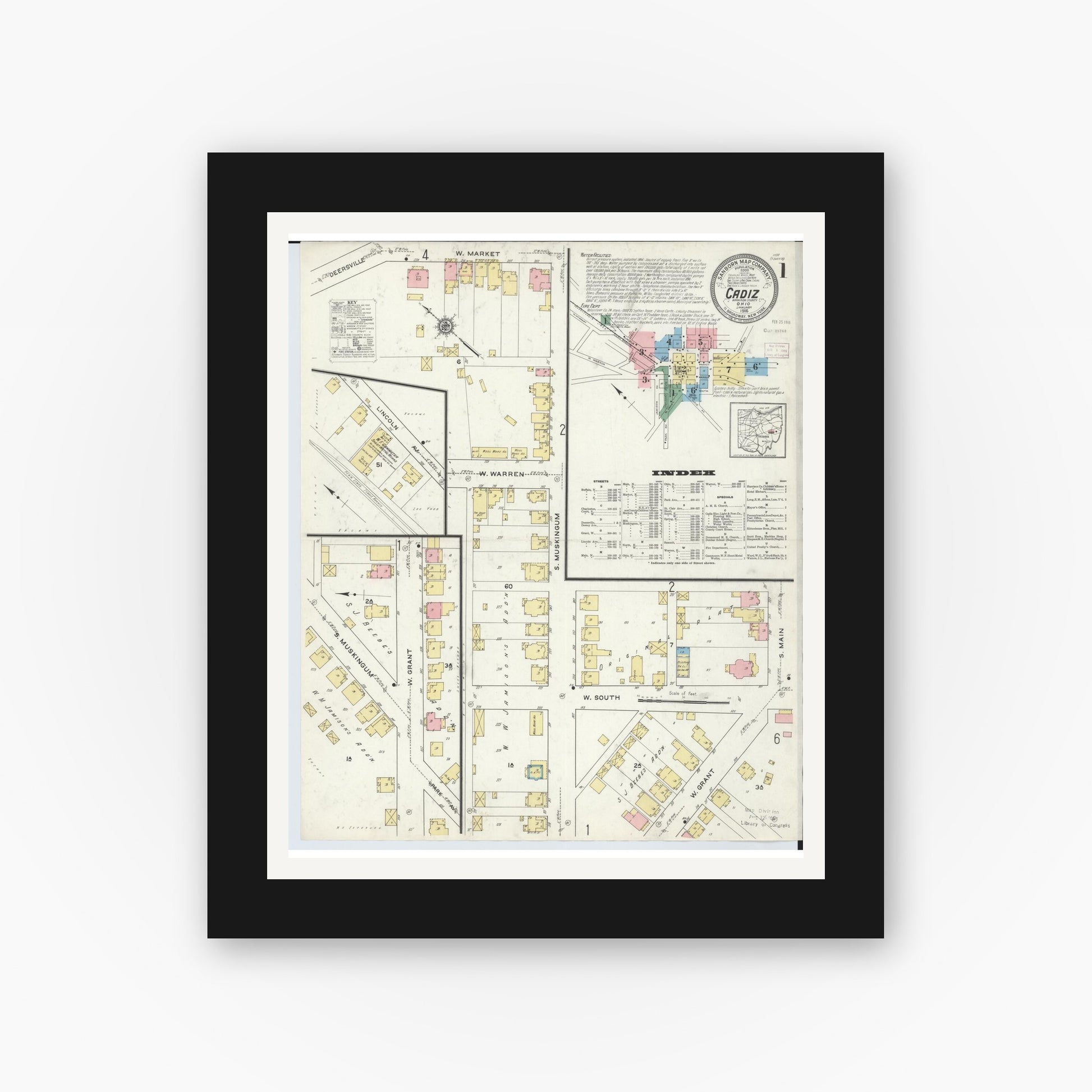 Old map wall art mockup — black gallery frame with white mat — Sanborn Fire Insurance Map from Cadiz, Harrison County, Ohio (1916), Sheet #0001