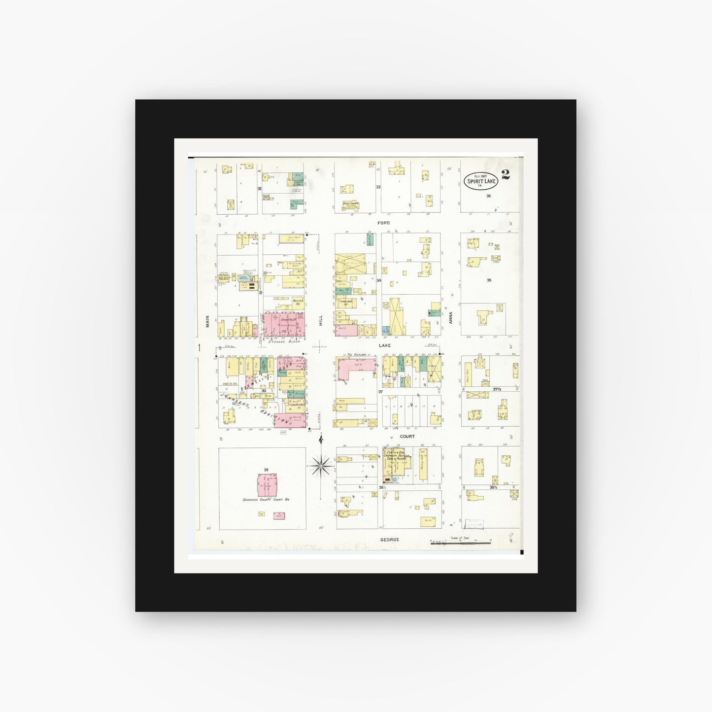 Old map wall art mockup — black gallery frame with white mat — Sanborn Fire Insurance Map from Spirit Lake, Dickinson County, Iowa (1907), Sheet #0002