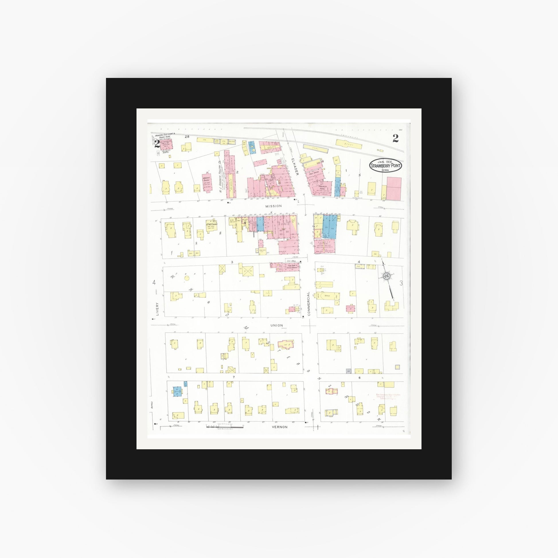 Old map wall art mockup — black gallery frame with white mat — Sanborn Fire Insurance Map from Strawberry Point, Clayton County, Iowa (1931), Sheet #0002
