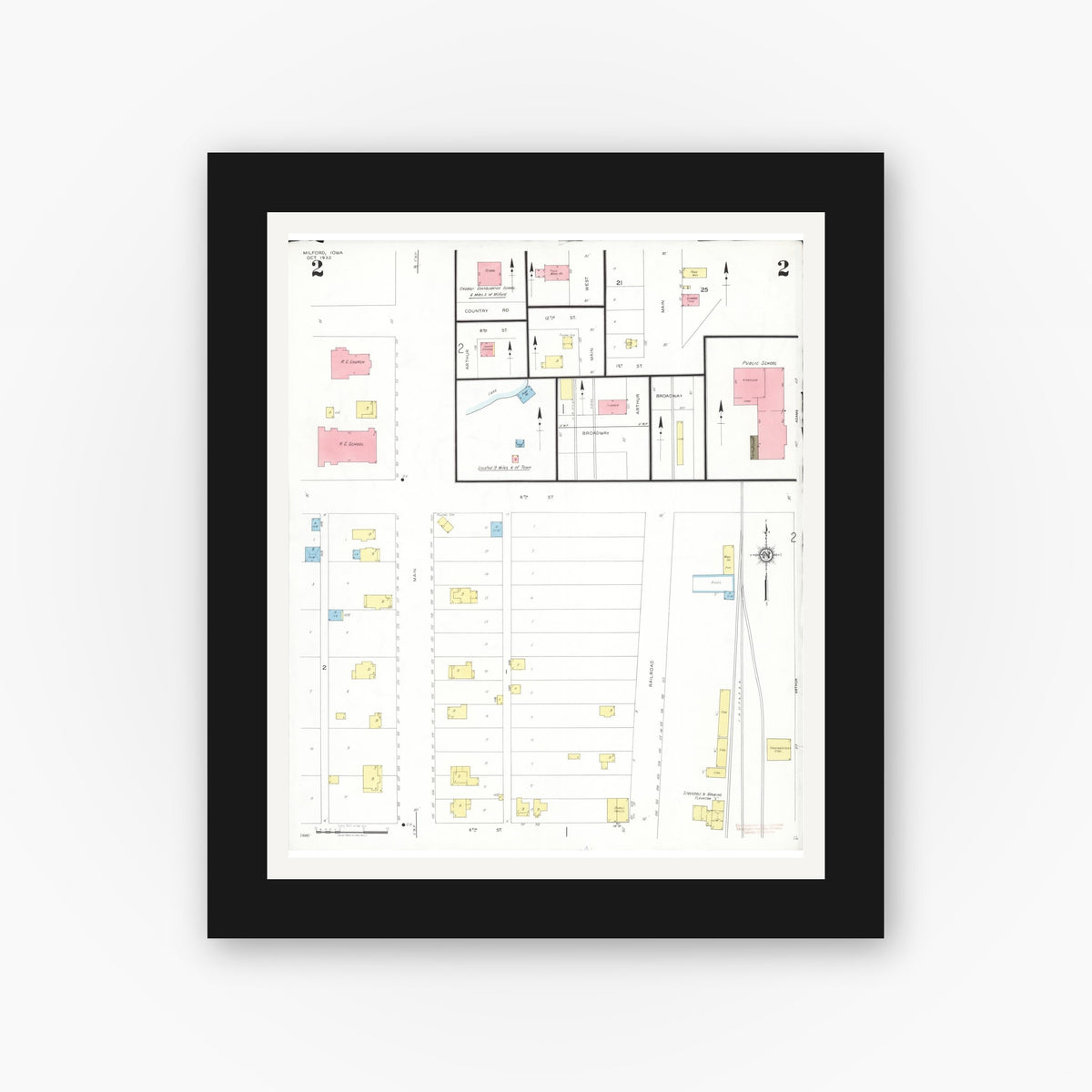 Old map wall art mockup — black gallery frame with white mat — Sanborn Fire Insurance Map from Milford, Dickinson County, Iowa (1932), Sheet #0002