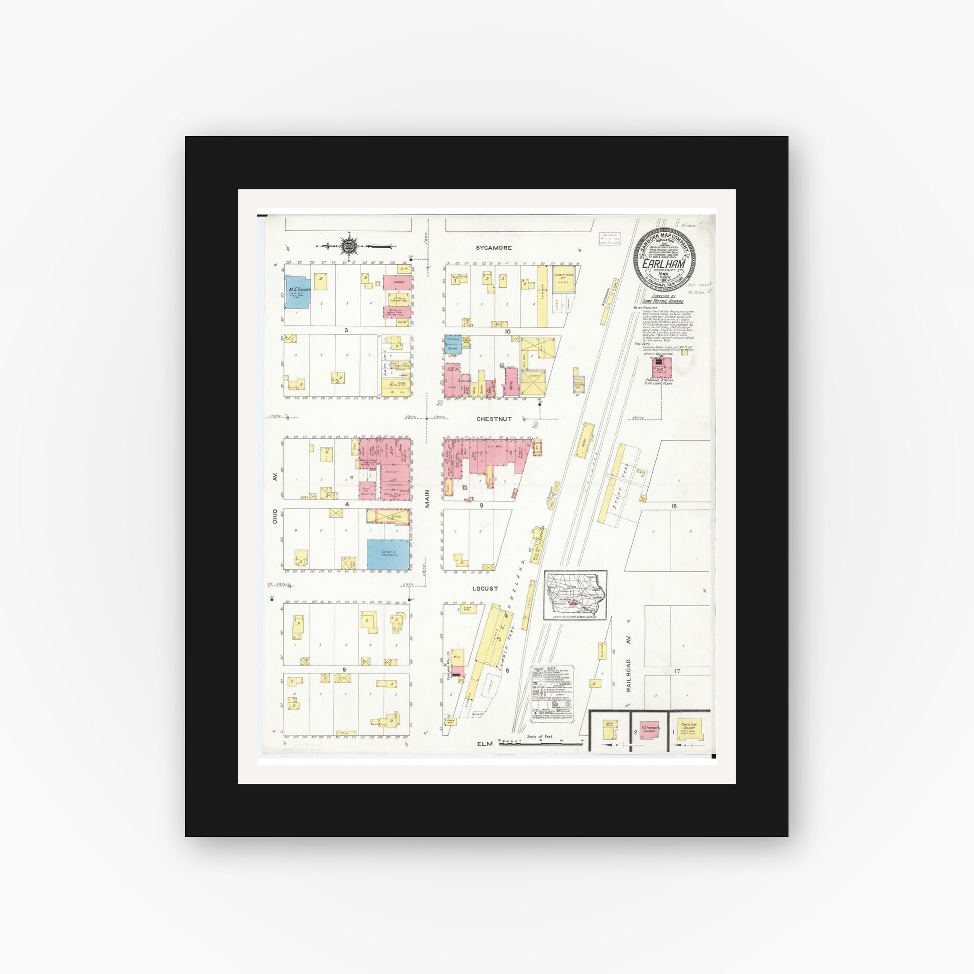 Old map wall art mockup — black gallery frame with white mat — Sanborn Fire Insurance Map from Earlham, Madison County, Iowa (1916), Sheet #0001