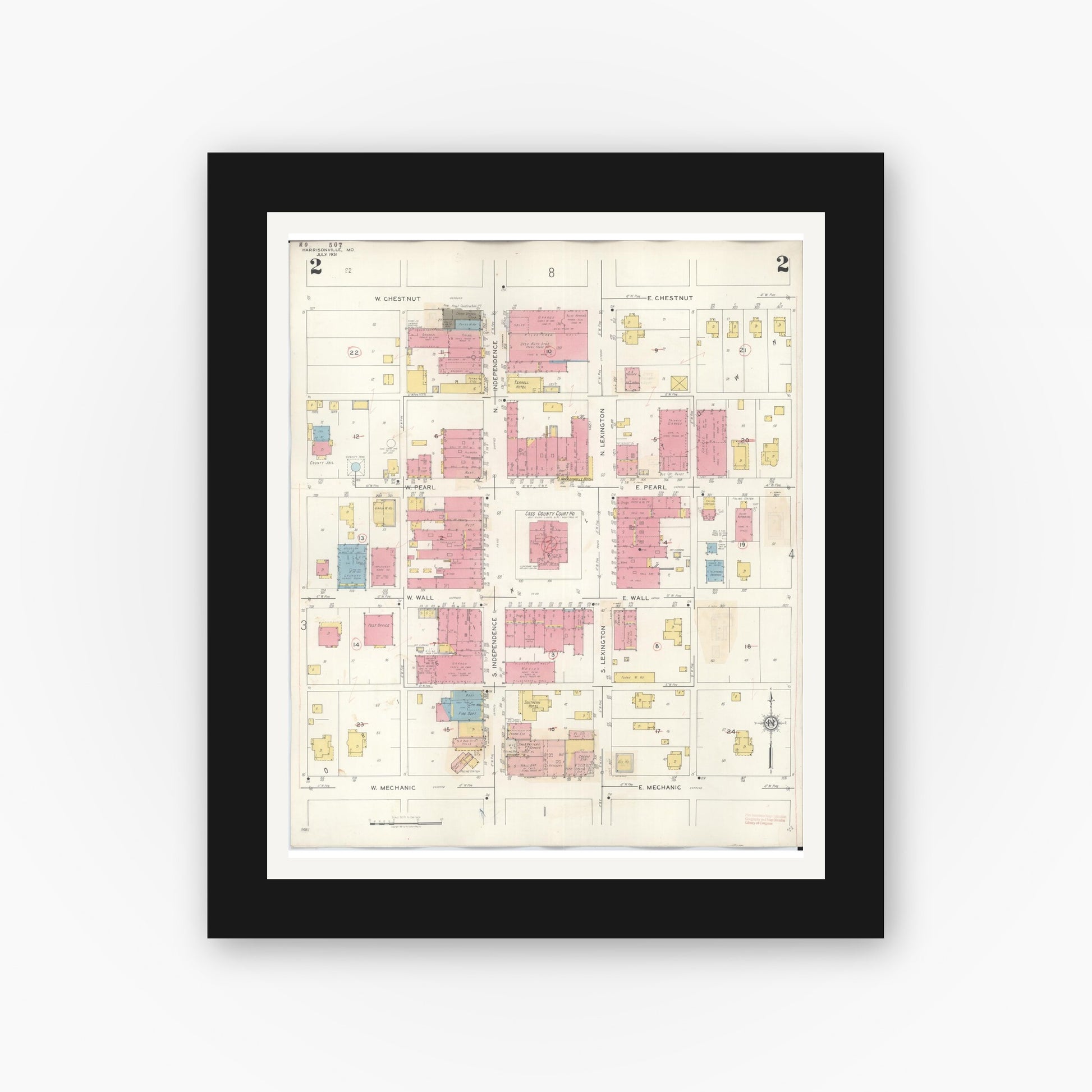Old map wall art mockup — black gallery frame with white mat — Sanborn Fire Insurance Map from Harrisonville, Cass County, Missouri (1939), Sheet #0002