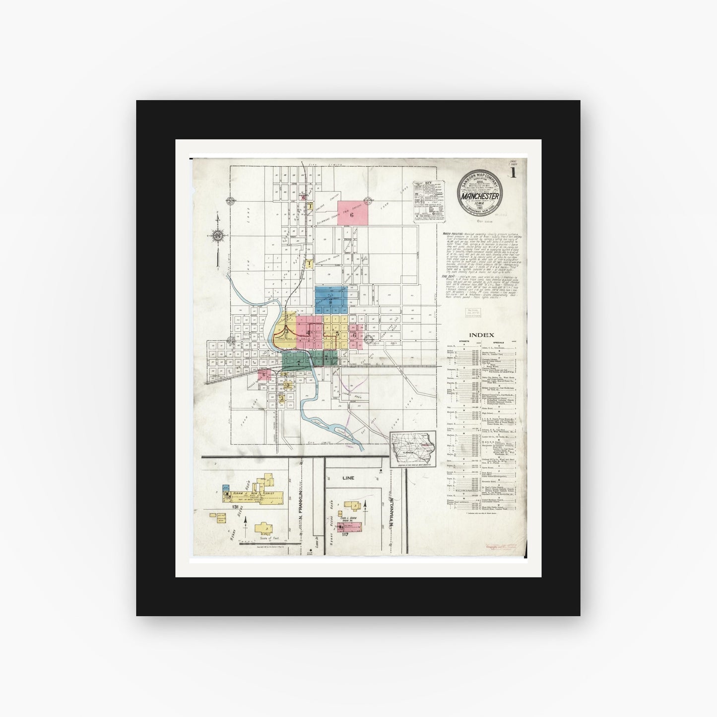 Old map wall art mockup — black gallery frame with white mat — Sanborn Fire Insurance Map from Manchester, Delaware County, Iowa (1921) â€” Complete Set