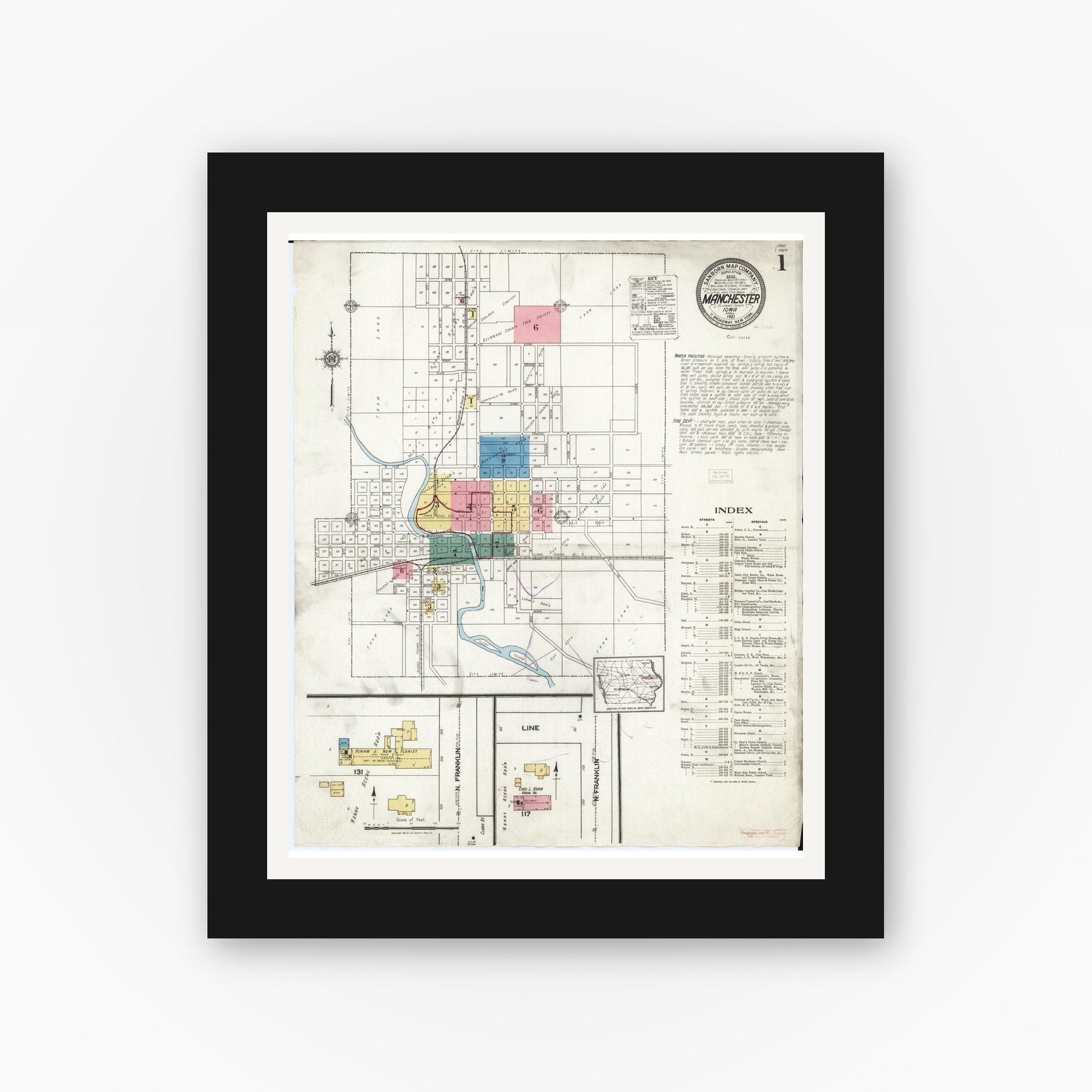 Old map wall art mockup — black gallery frame with white mat — Sanborn Fire Insurance Map from Manchester, Delaware County, Iowa (1921) â€” Complete Set