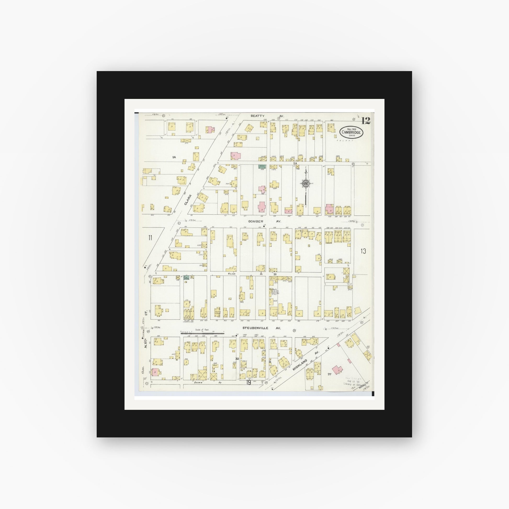 Old map wall art mockup — black gallery frame with white mat — Sanborn Fire Insurance Map from Cambridge, Guernsey County, Ohio (1909), Sheet #0012