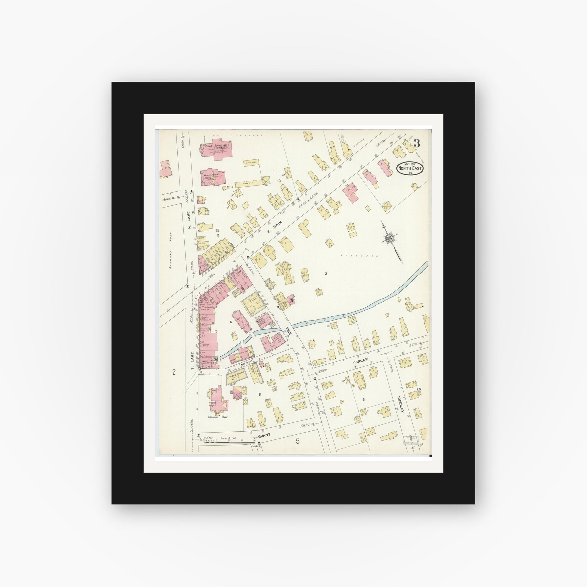 Old map wall art mockup — black gallery frame with white mat — Sanborn Fire Insurance Map from North East, Erie County, Pennsylvania (1912), Sheet #0003