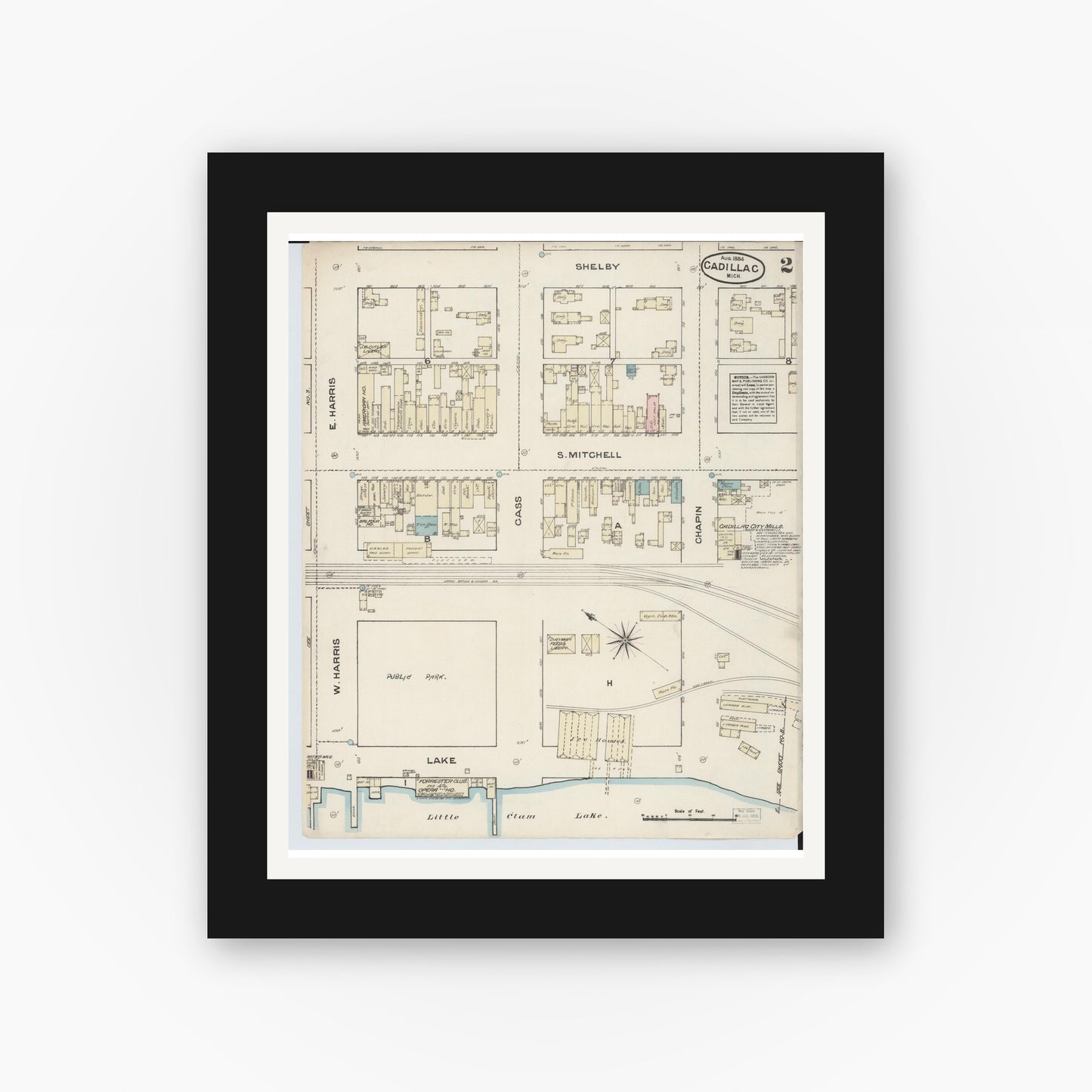 Old map wall art mockup — black gallery frame with white mat — Sanborn Fire Insurance Map from Cadillac, Wexford County, Michigan (1884), Sheet #0002