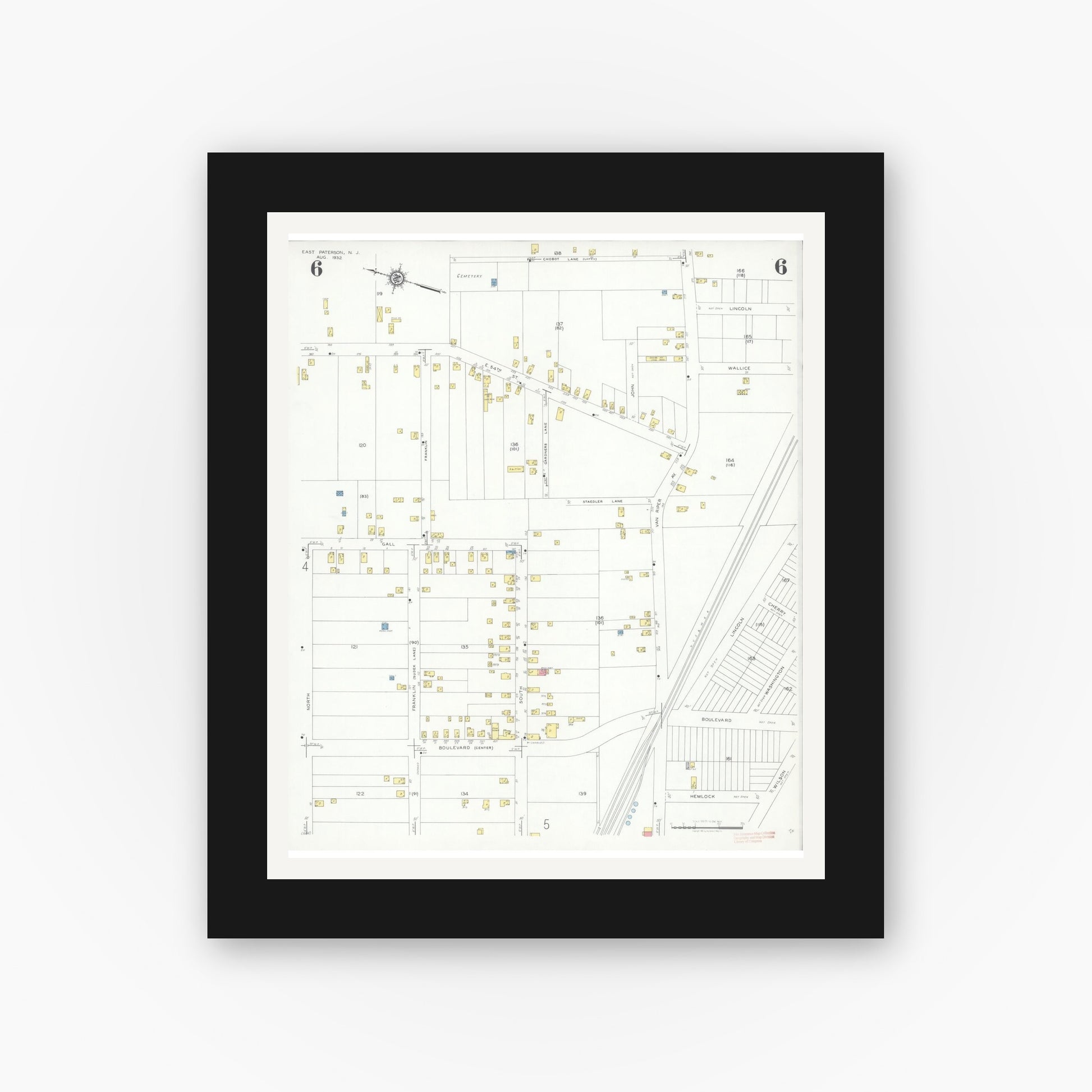 Old map wall art mockup — black gallery frame with white mat — Sanborn Fire Insurance Map from East Paterson, Bergen County, New Jersey (1932), Sheet #0006