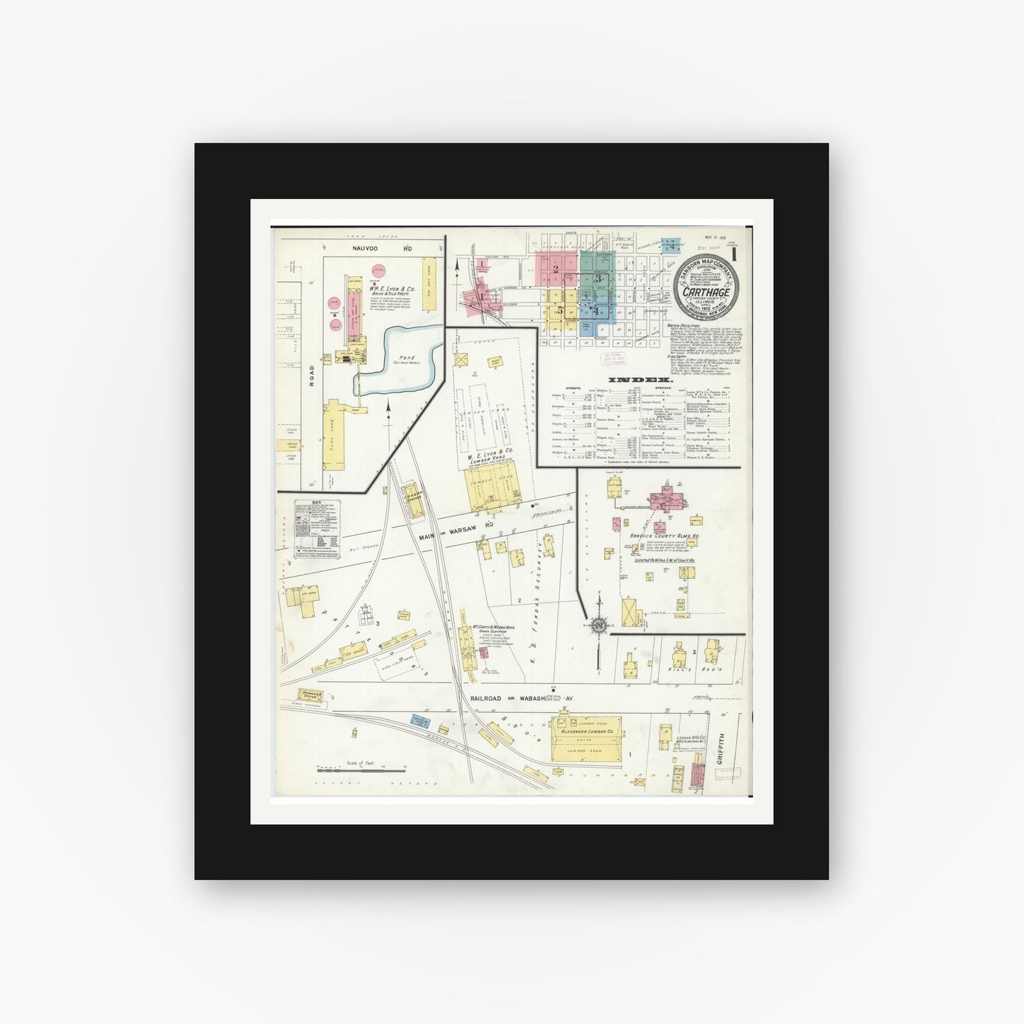 Old map wall art mockup — black gallery frame with white mat — Sanborn Fire Insurance Map from Carthage, Hancock County, Illinois (1912), Sheet #0001