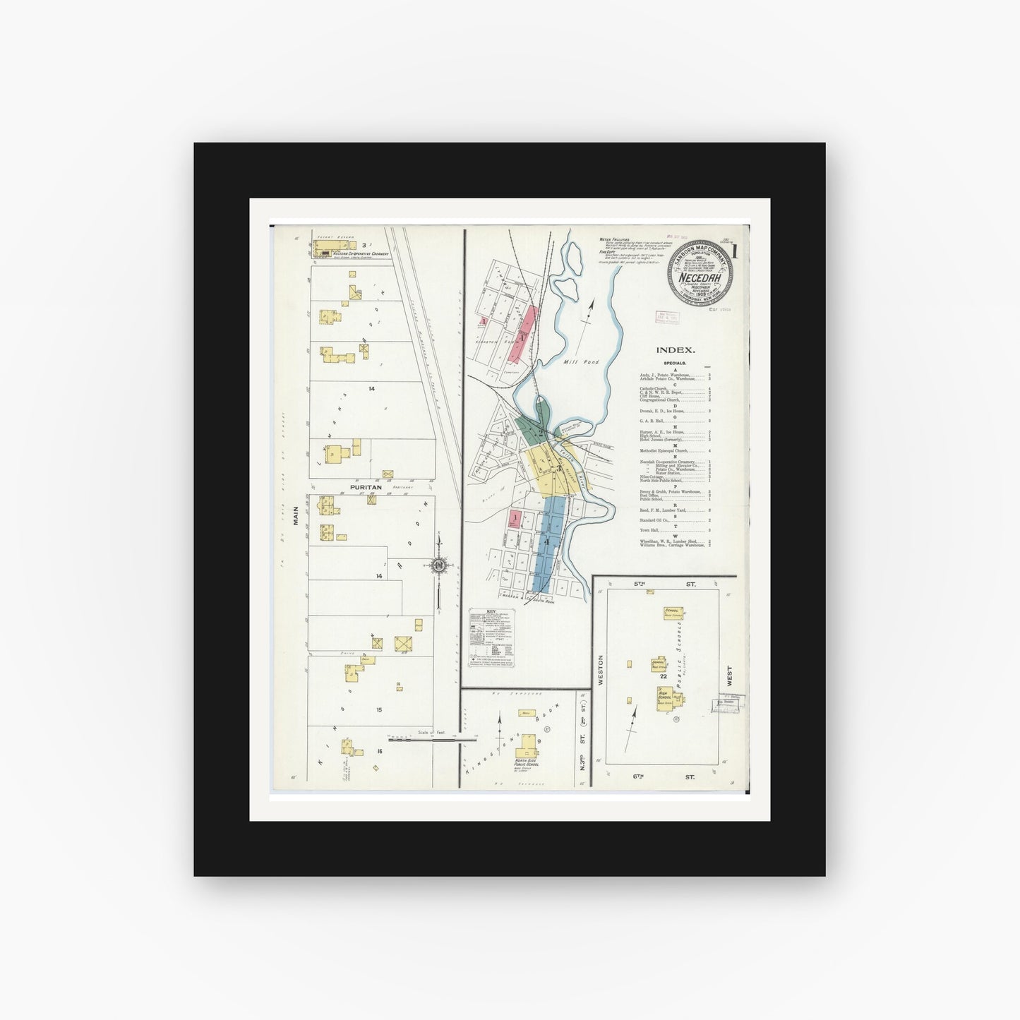 Old map wall art mockup — black gallery frame with white mat — Sanborn Fire Insurance Map from Necedah, Juneau County, Wisconsin (1909), Sheet #0001