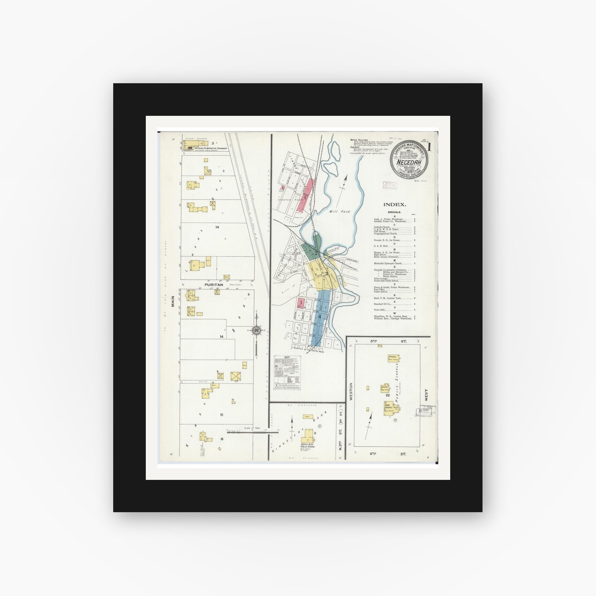 Old map wall art mockup — black gallery frame with white mat — Sanborn Fire Insurance Map from Necedah, Juneau County, Wisconsin (1909), Sheet #0001