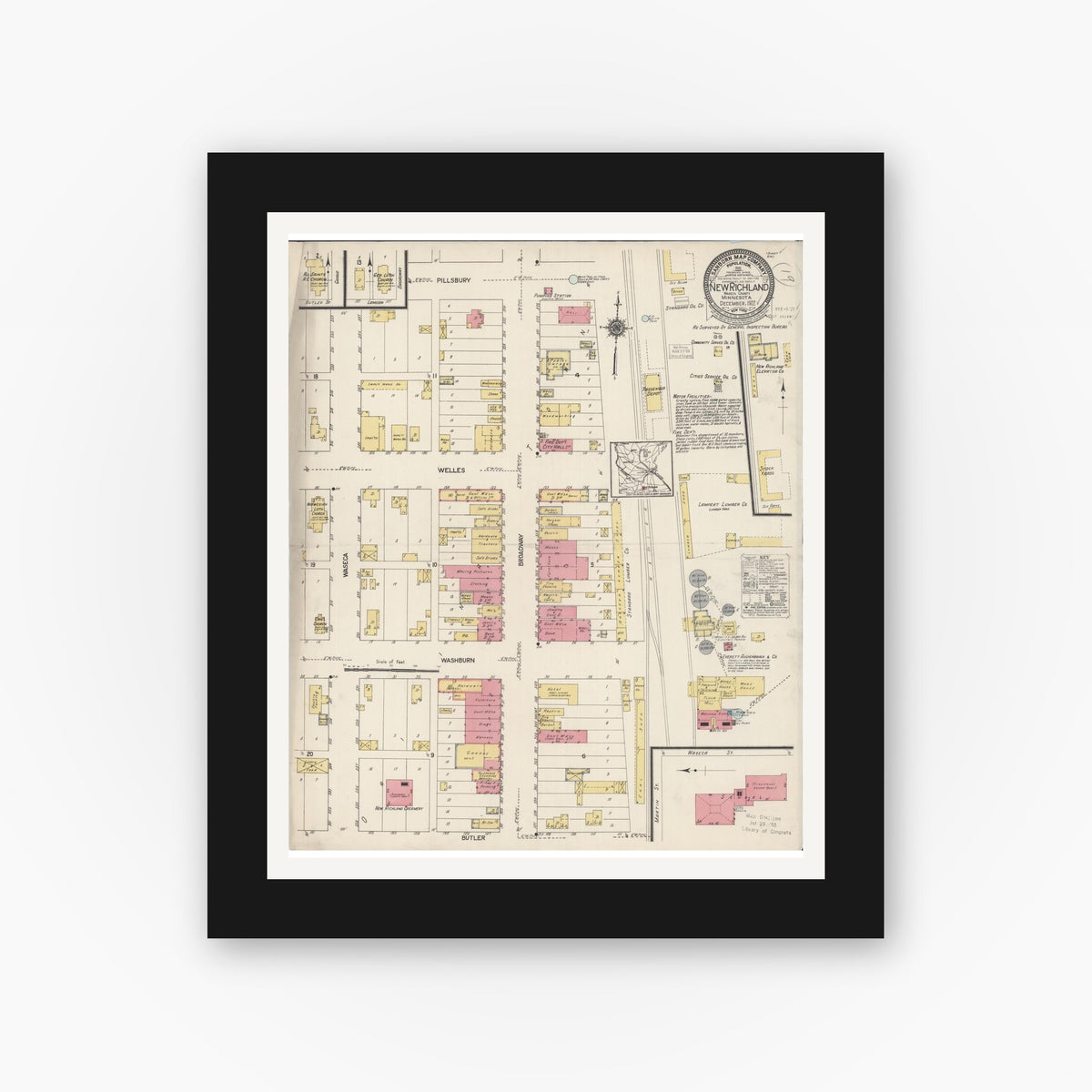 Old map wall art mockup — black gallery frame with white mat — Sanborn Fire Insurance Map from New Richland, Waseca County, Minnesota (1922), Sheet #0001