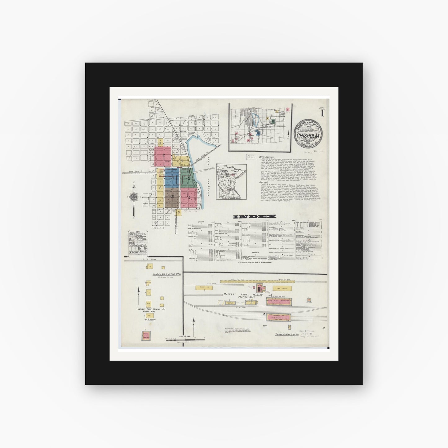 Old map wall art mockup — black gallery frame with white mat — Sanborn Fire Insurance Map from Chisholm, Saint Louis County, Minnesota (1921), Sheet #0001