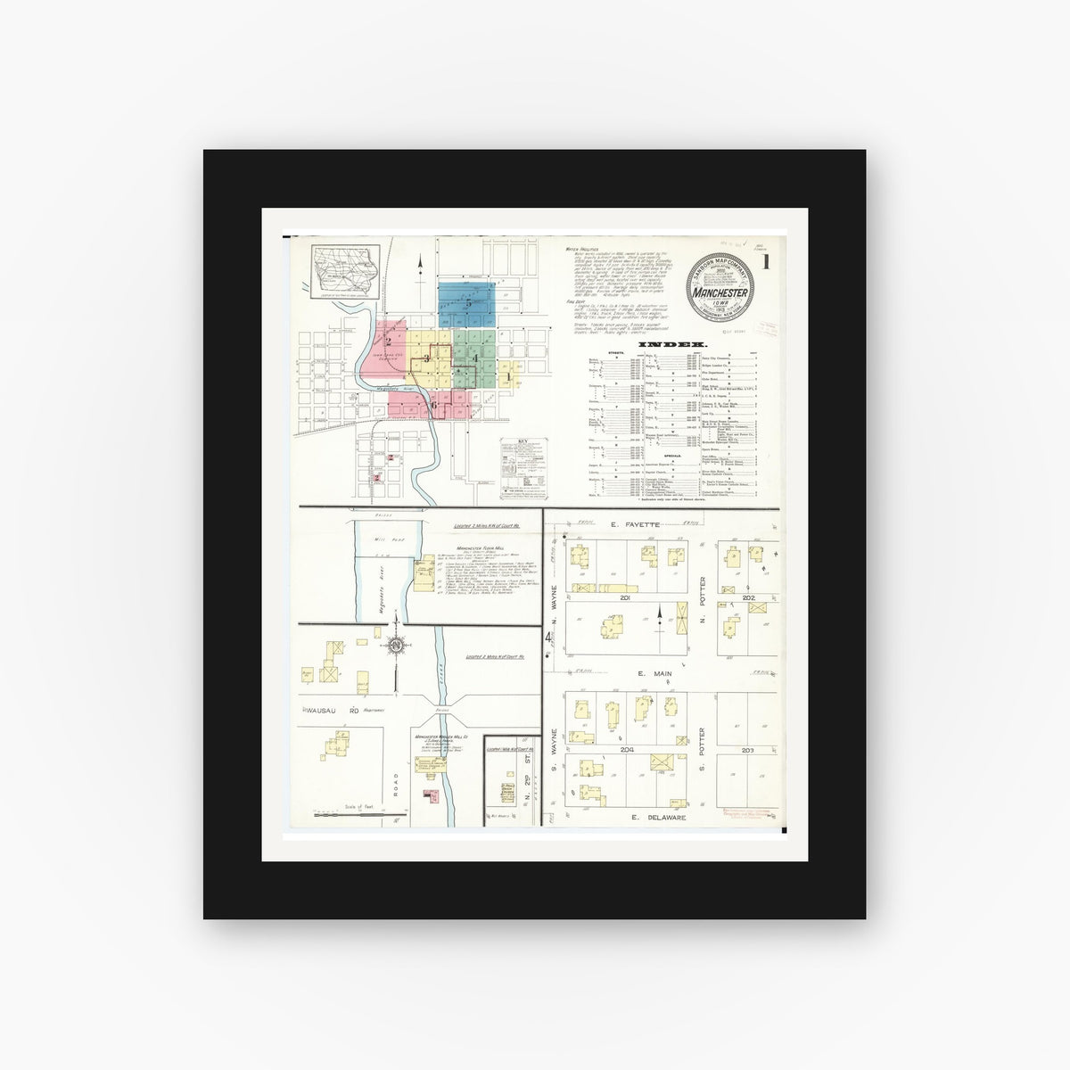 Old map wall art mockup — black gallery frame with white mat — Sanborn Fire Insurance Map from Manchester, Delaware County, Iowa (1913) â€” Complete Set