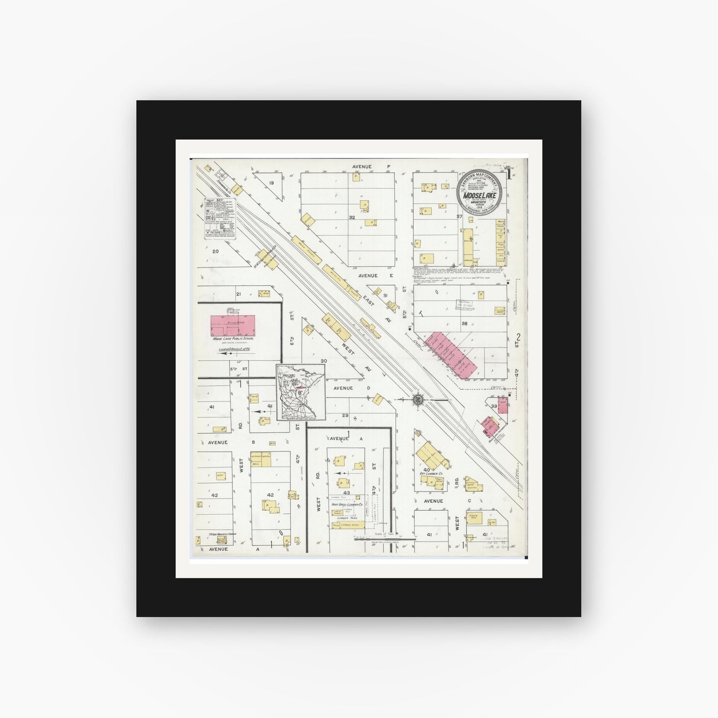 Old map wall art mockup — black gallery frame with white mat — Sanborn Fire Insurance Map from Moose Lake, Carlton County, Minnesota (1919) - Complete Map Set