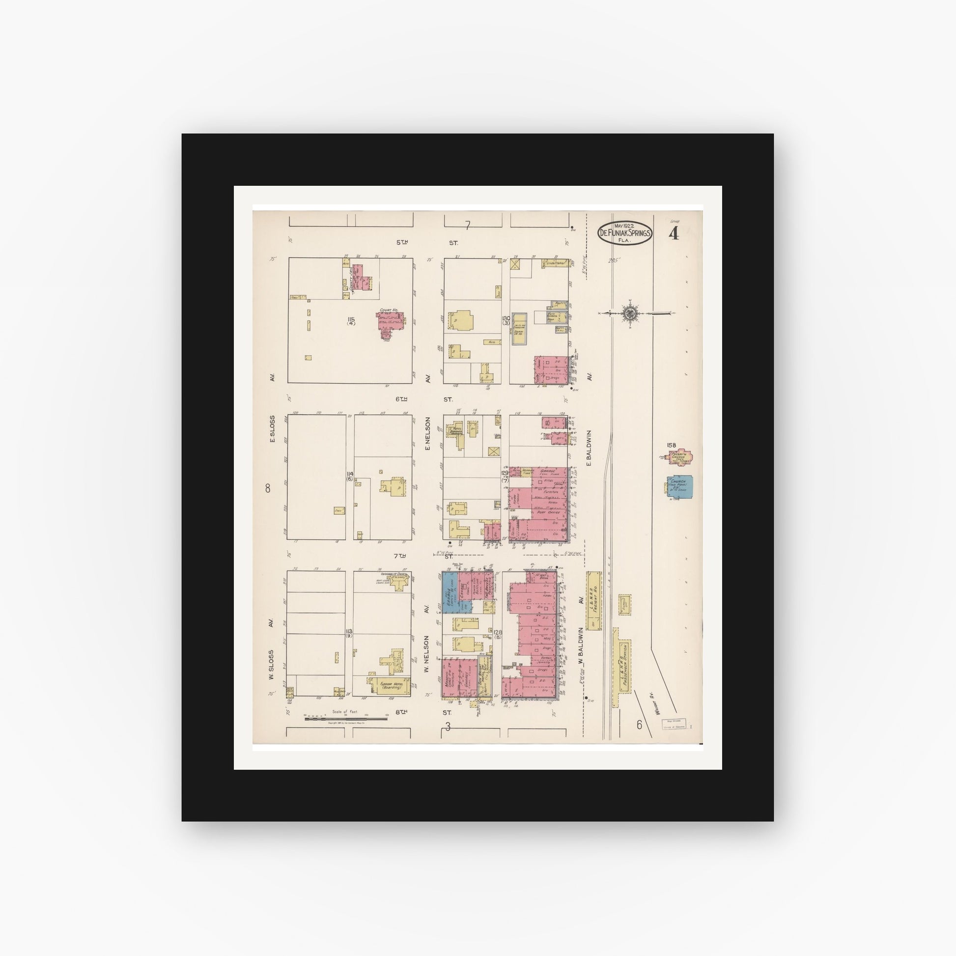 Old map wall art mockup — black gallery frame with white mat — Sanborn Fire Insurance Map from De Funiak Springs, Walton County, Florida (1922), Sheet #0004