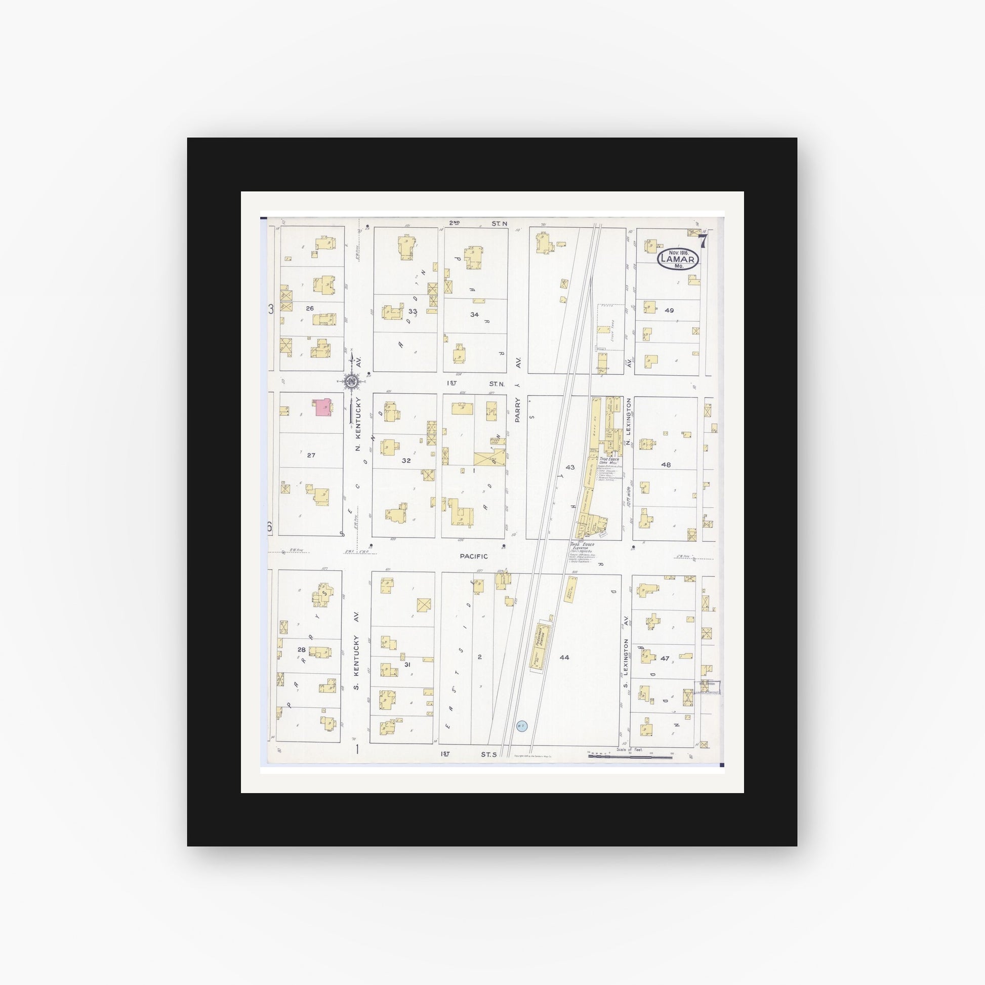 Old map wall art mockup — black gallery frame with white mat — Sanborn Fire Insurance Map from Lamar, Barton County, Missouri (1916), Sheet #0007
