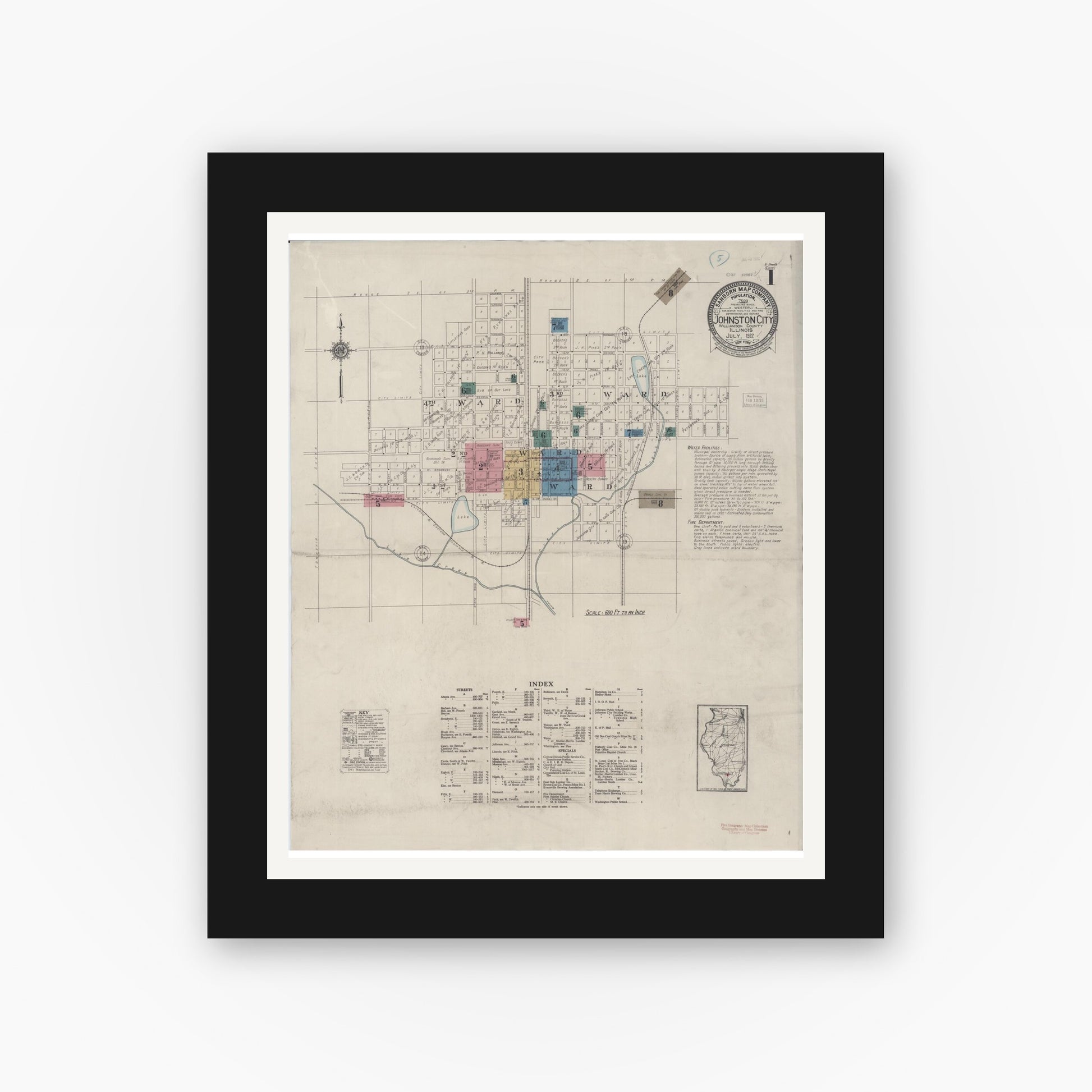 Old map wall art mockup — black gallery frame with white mat — Sanborn Fire Insurance Map from Johnston City, Williamson County, Illinois (1922), Sheet #0001