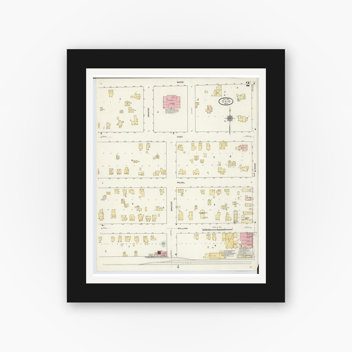 Old map wall art mockup — black gallery frame with white mat — Sanborn Fire Insurance Map from Ovid, Clinton County, Michigan (1910), Sheet #0002