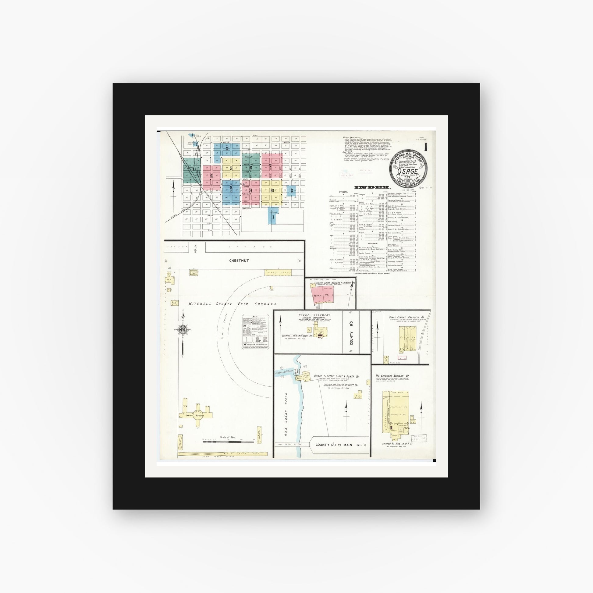 Old map wall art mockup — black gallery frame with white mat — Sanborn Fire Insurance Map from Osage, Mitchell County, Iowa (1911) â€” Complete Set