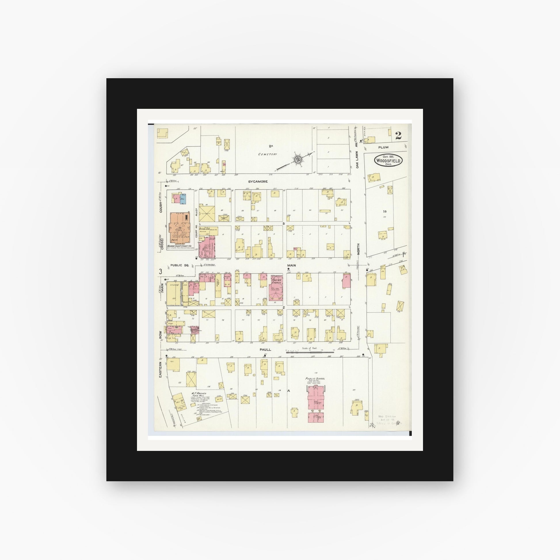 Old map wall art mockup — black gallery frame with white mat — Sanborn Fire Insurance Map from Woodsfield, Monroe County, Ohio (1911), Sheet #0002