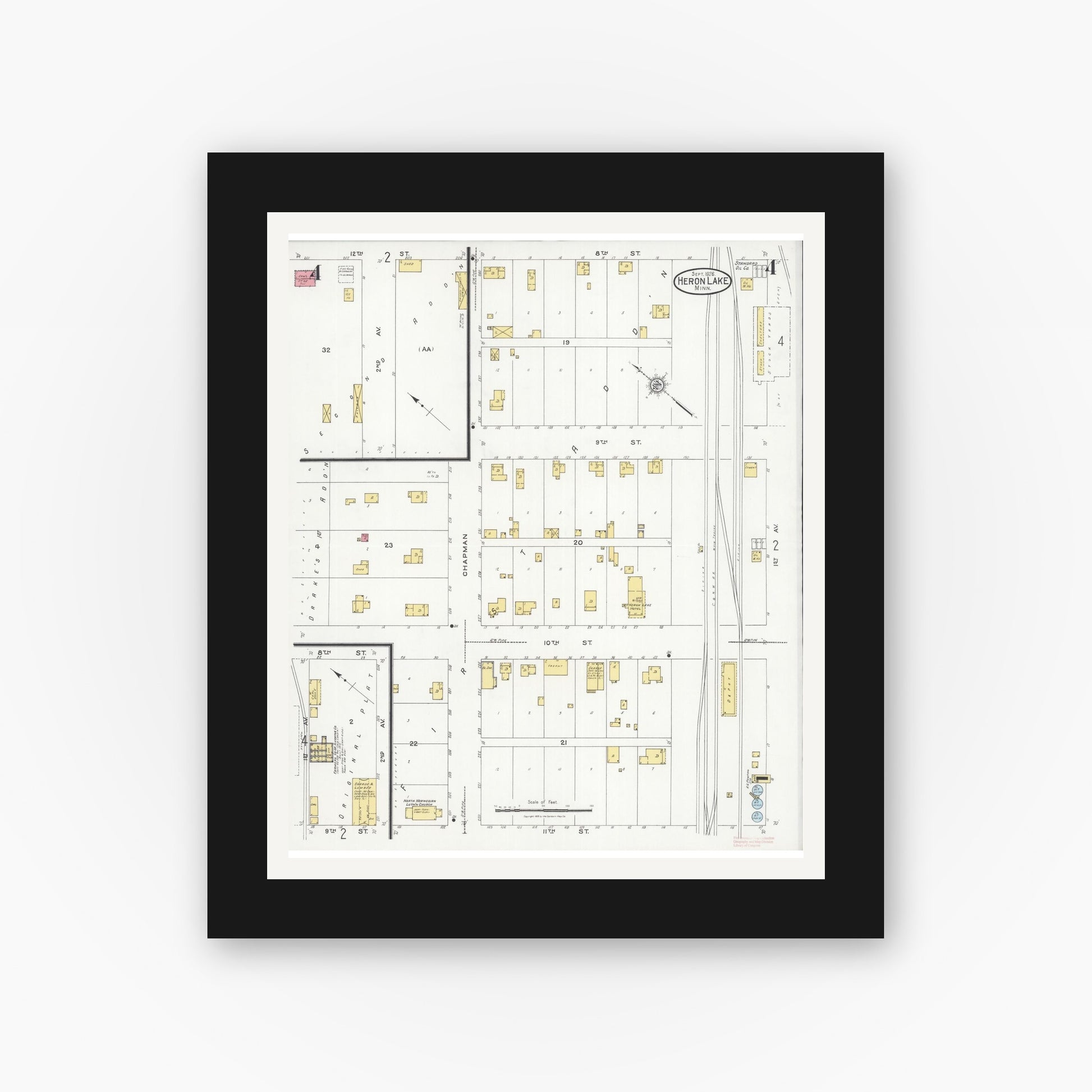 Old map wall art mockup — black gallery frame with white mat — Sanborn Fire Insurance Map from Heron Lake, Jackson County, Minnesota (1926), Sheet #0004