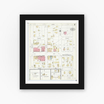 Old map wall art mockup — black gallery frame with white mat — Sanborn Fire Insurance Map from Carson City, Montcalm County, Michigan (1910), Sheet #0002