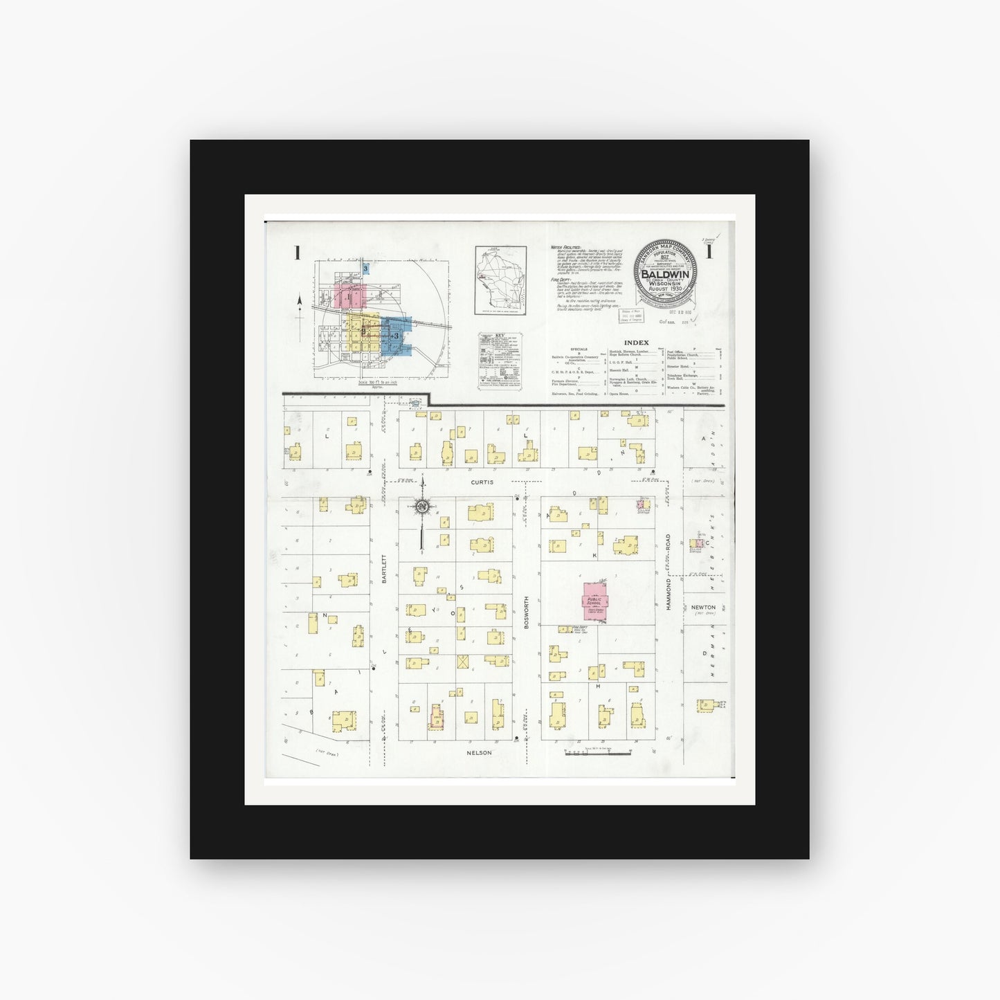 Old map wall art mockup — black gallery frame with white mat — Sanborn Fire Insurance Map from Baldwin, St. Croix County, Wisconsin (1930) - Complete Map Set