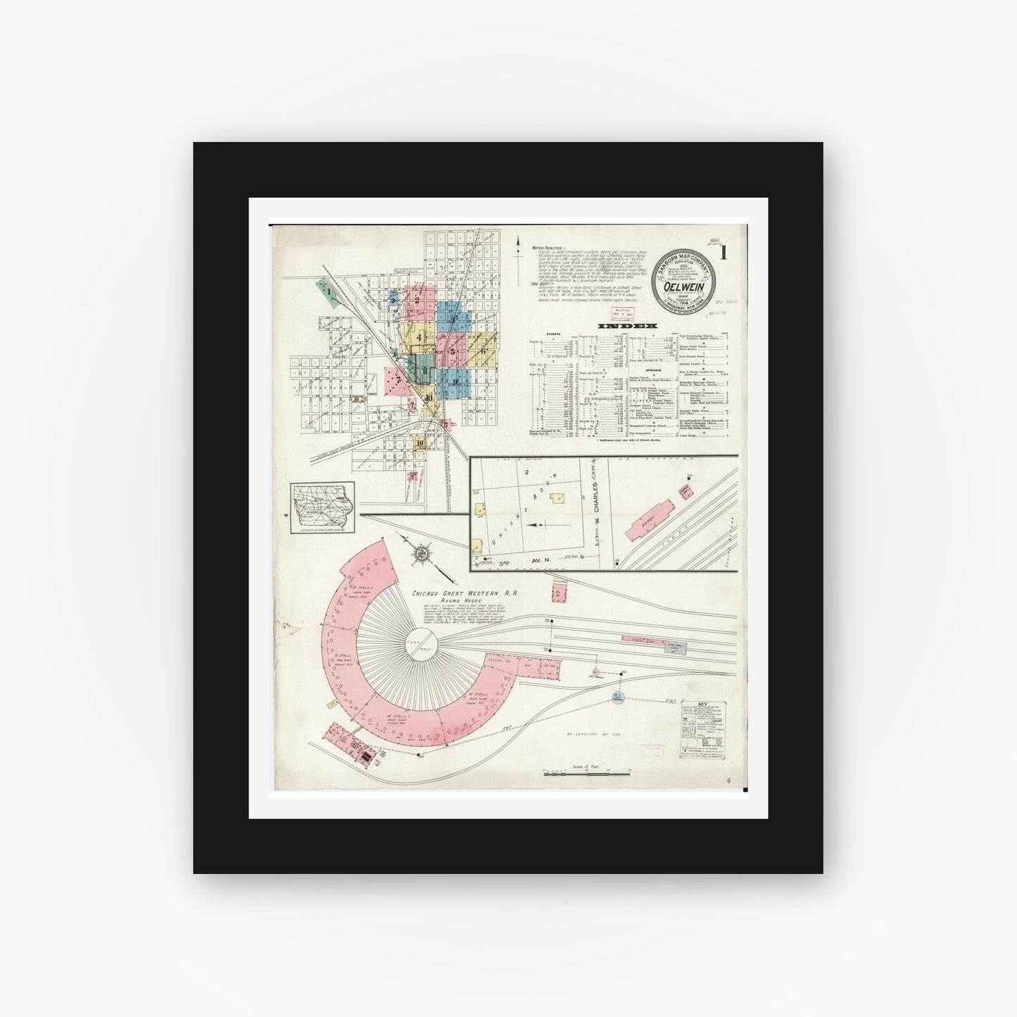 Old map wall art mockup — black gallery frame with white mat — Sanborn Fire Insurance Map from Oelwein, Fayette County, Iowa (1914) â€” Complete Set