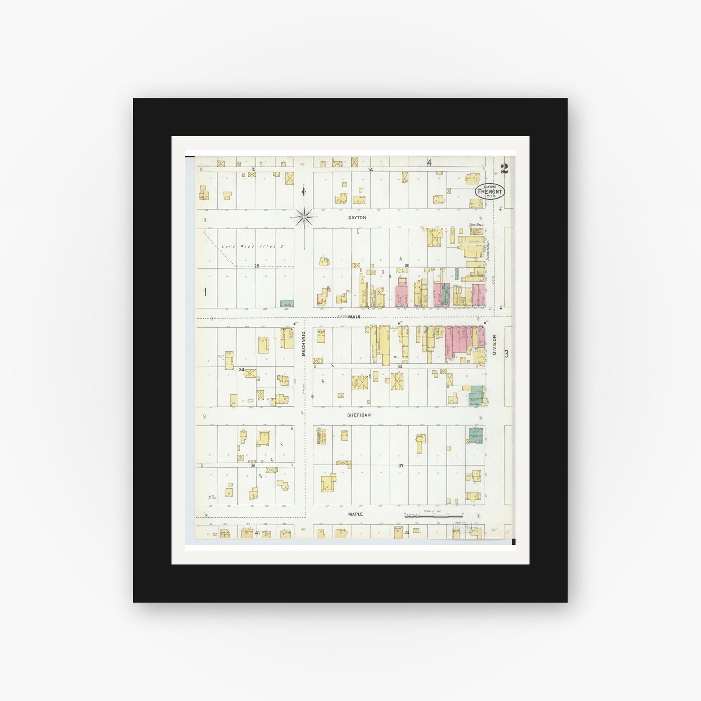 Old map wall art mockup — black gallery frame with white mat — Sanborn Fire Insurance Map from Fremont, Newaygo County, Michigan (1899), Sheet #0002