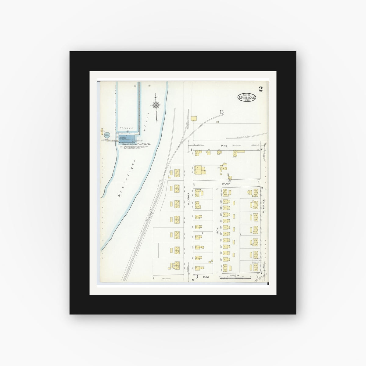 Old map wall art mockup — black gallery frame with white mat — Sanborn Fire Insurance Map from Manistique, Schoolcraft County, Michigan (1914), Sheet #0002