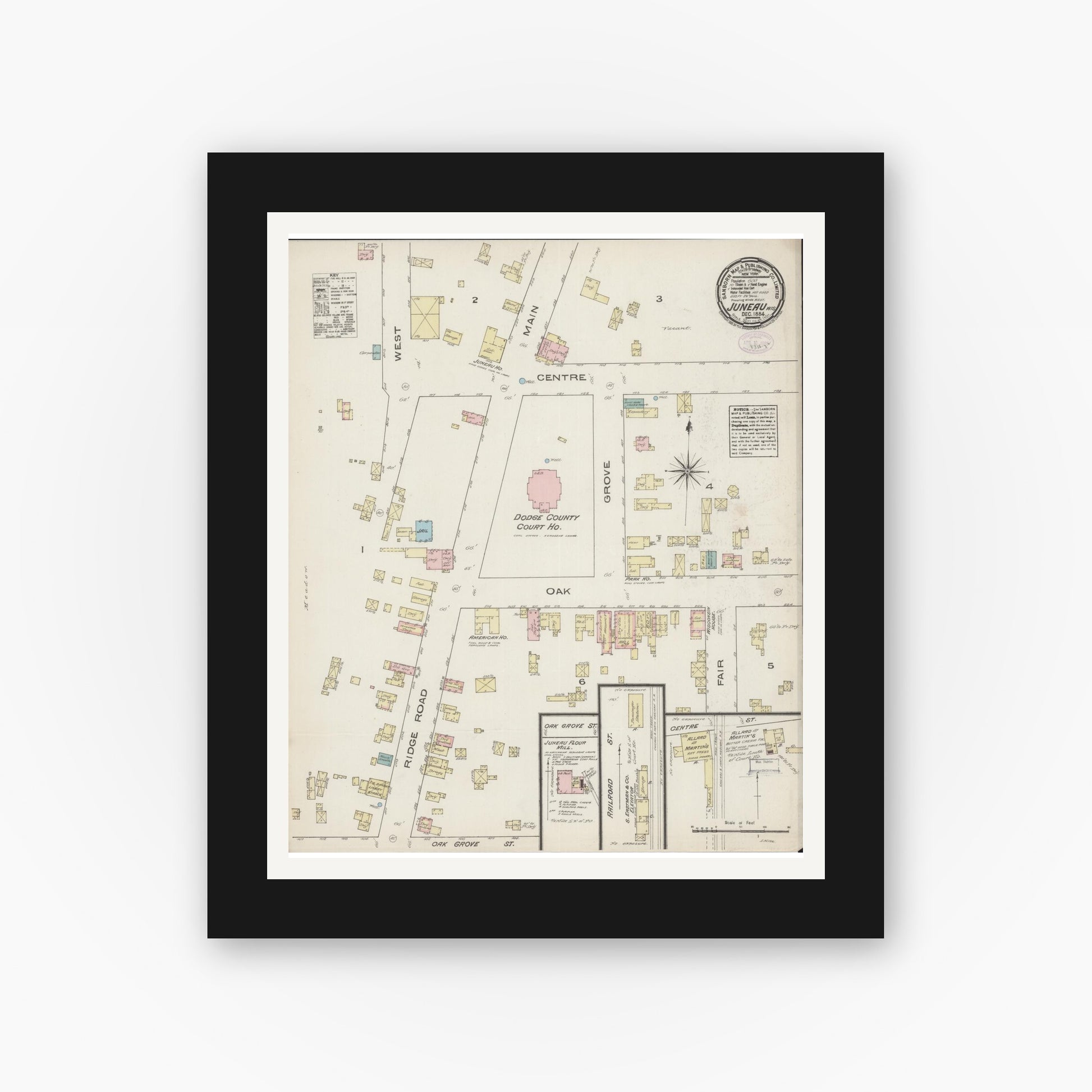 Old map wall art mockup — black gallery frame with white mat — Sanborn Fire Insurance Map from Juneau, Dodge County, Wisconsin (1884), Sheet #0001