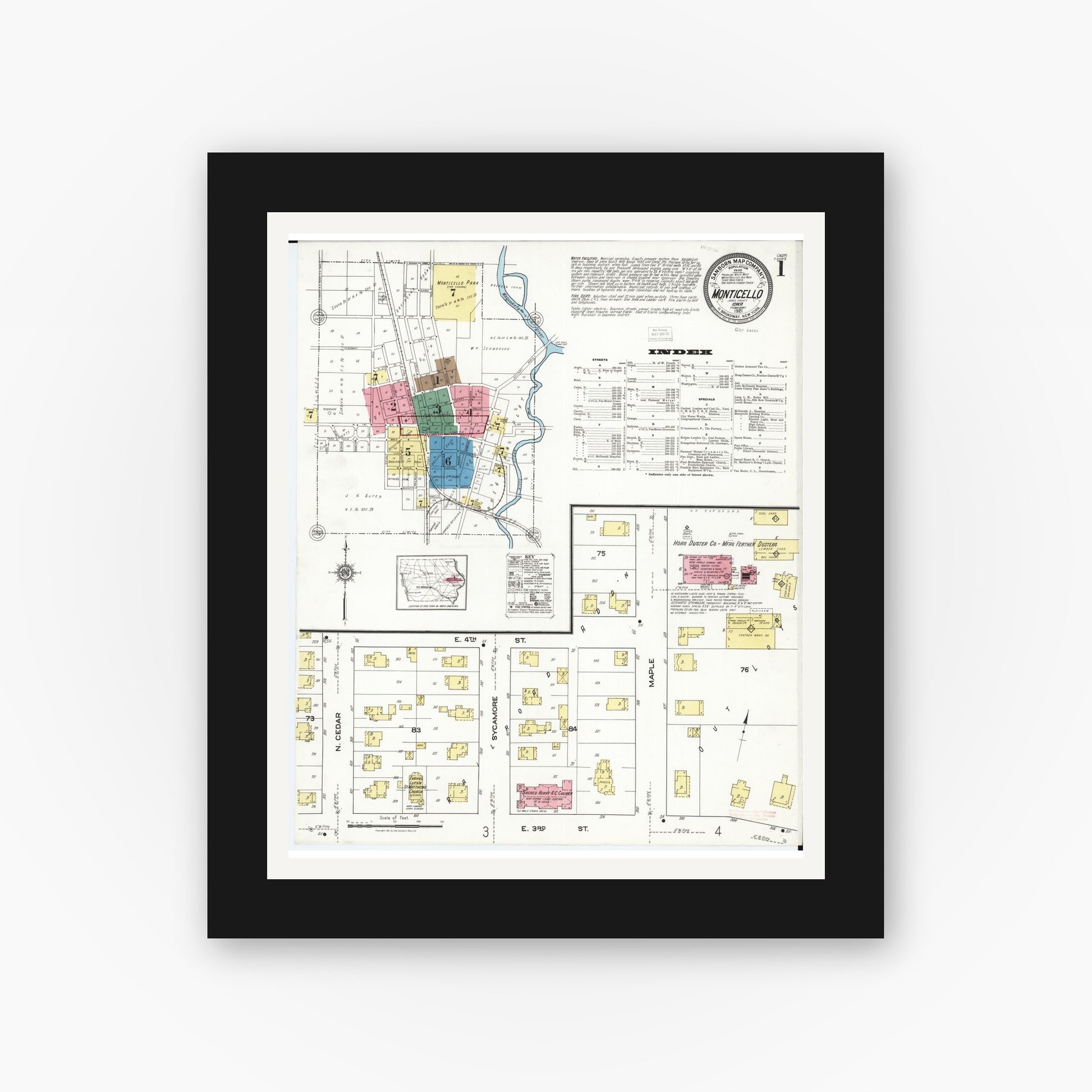 Old map wall art mockup — black gallery frame with white mat — Sanborn Fire Insurance Map from Monticello, Jones County, Iowa (1921) â€” Complete Set
