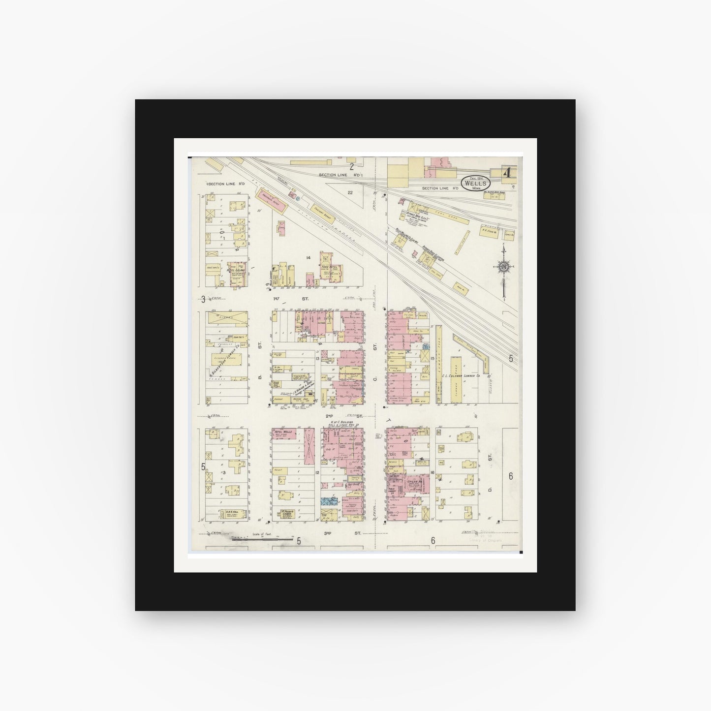Old map wall art mockup — black gallery frame with white mat — Sanborn Fire Insurance Map from Wells, Faribault County, Minnesota (1914), Sheet #0004