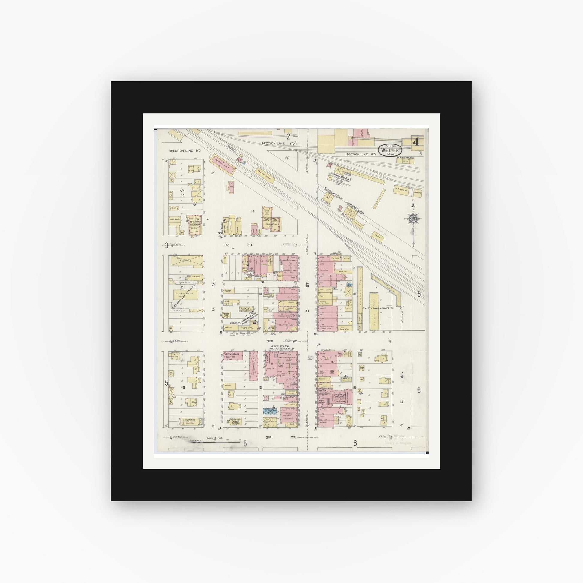Old map wall art mockup — black gallery frame with white mat — Sanborn Fire Insurance Map from Wells, Faribault County, Minnesota (1914), Sheet #0004