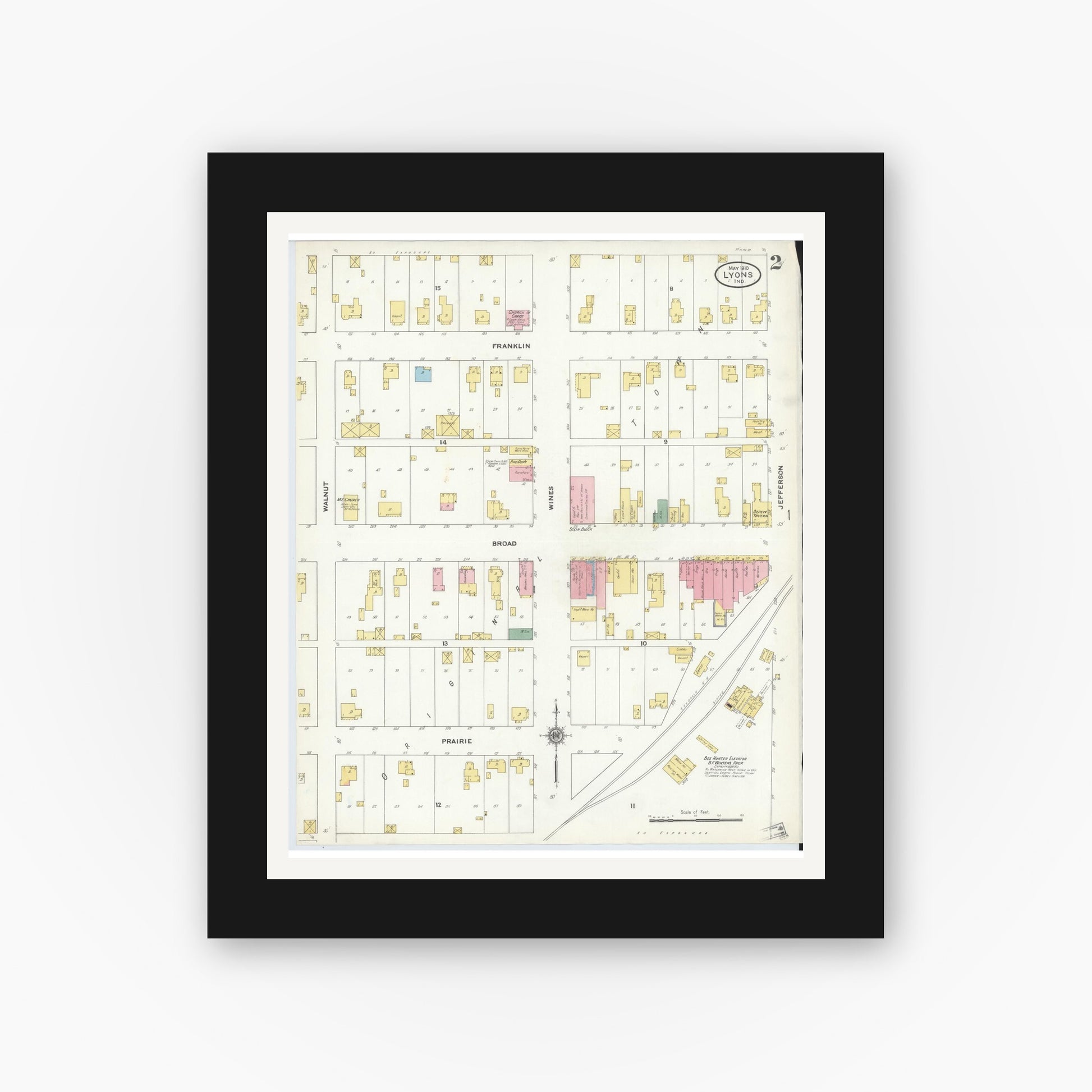 Old map wall art mockup — black gallery frame with white mat — Sanborn Fire Insurance Map from Lyons, Greene County, Indiana (1910), Sheet #0002
