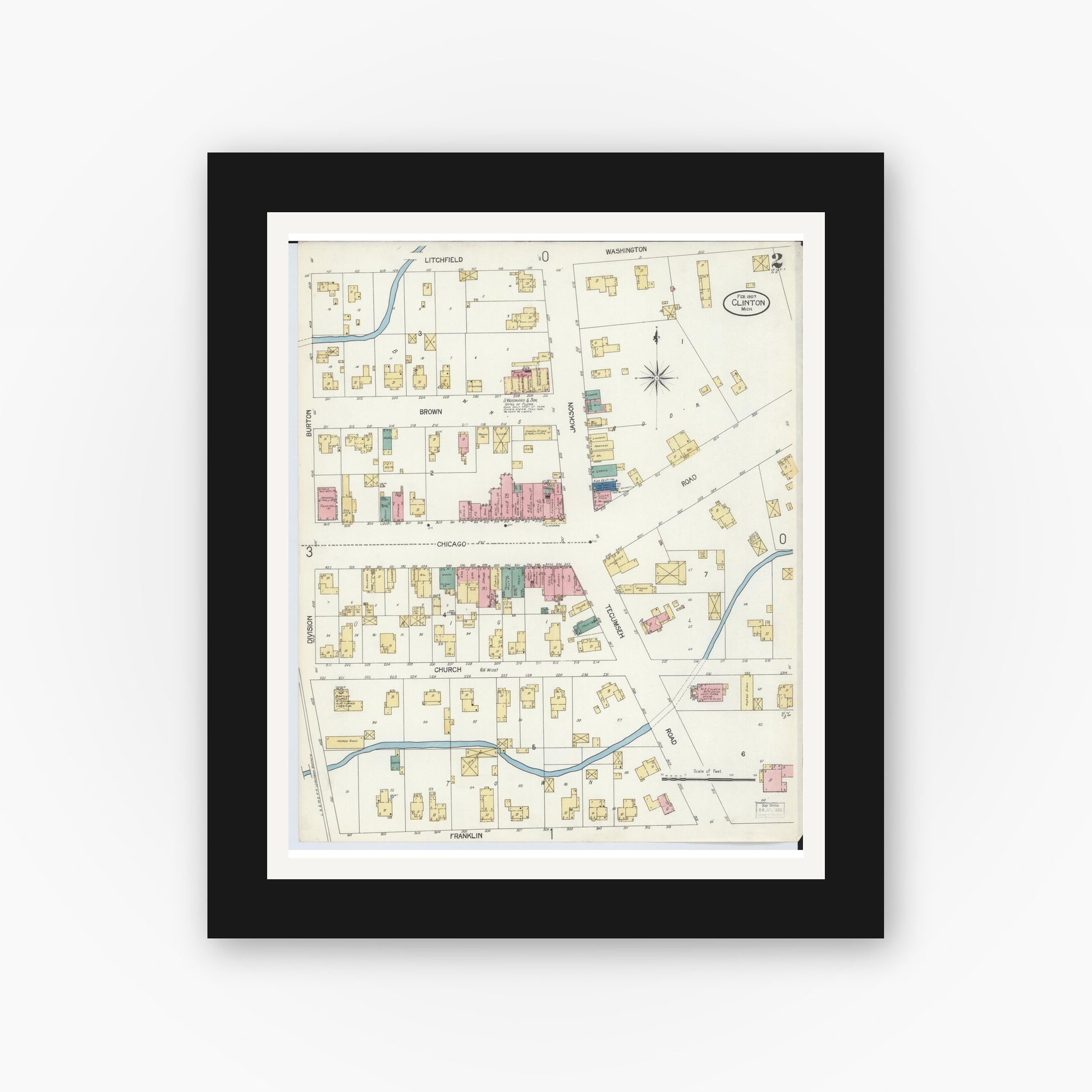Old map wall art mockup — black gallery frame with white mat — Sanborn Fire Insurance Map from Clinton, Lenawee County, Michigan (1907), Sheet #0002