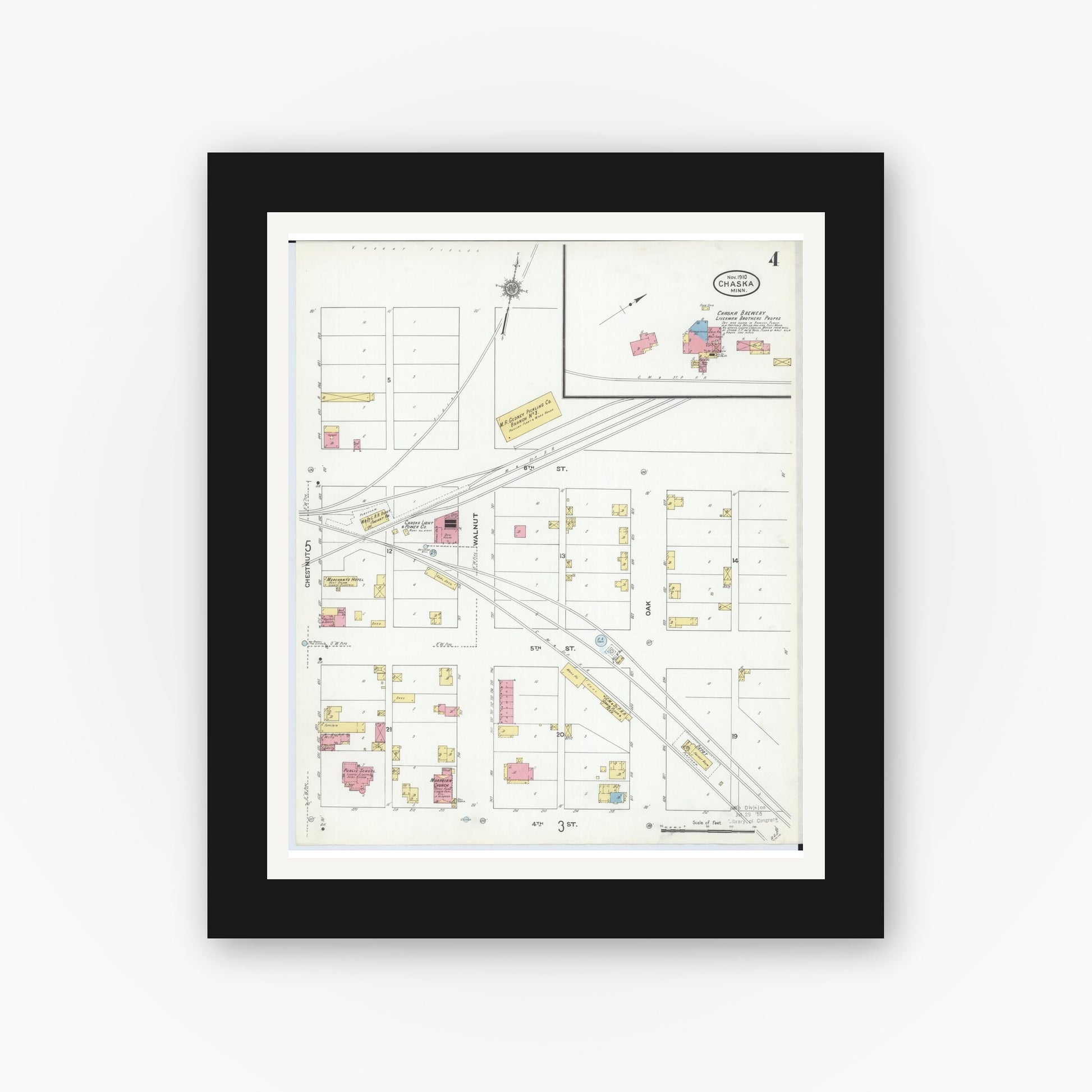 Old map wall art mockup — black gallery frame with white mat — Sanborn Fire Insurance Map from Chaska, Carver County, Minnesota (1910), Sheet #0004