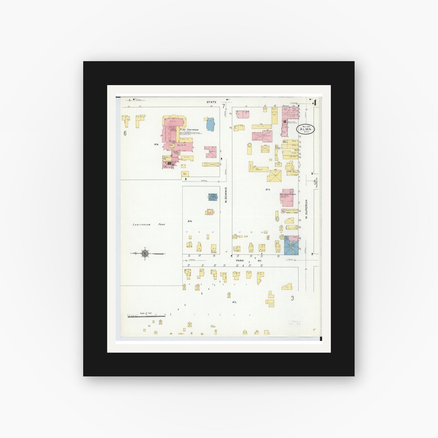 Old map wall art mockup — black gallery frame with white mat — Sanborn Fire Insurance Map from Alma, Gratiot County, Michigan (1910), Sheet #0004