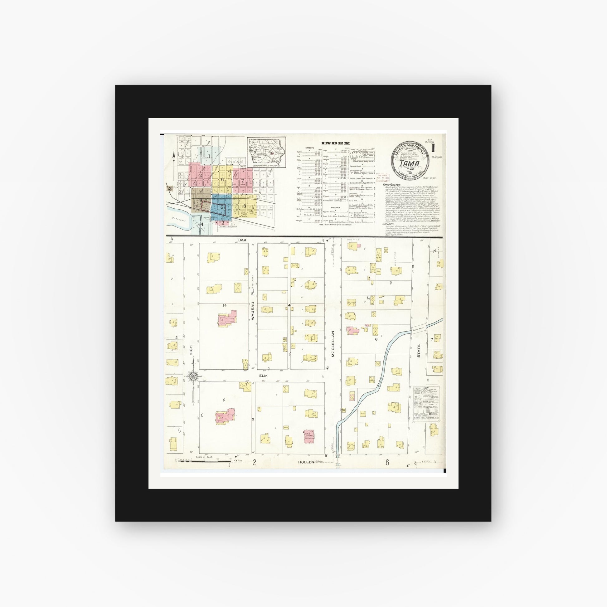 Old map wall art mockup — black gallery frame with white mat — Sanborn Fire Insurance Map from Tama, Tama County, Iowa (1915) â€” Complete Set