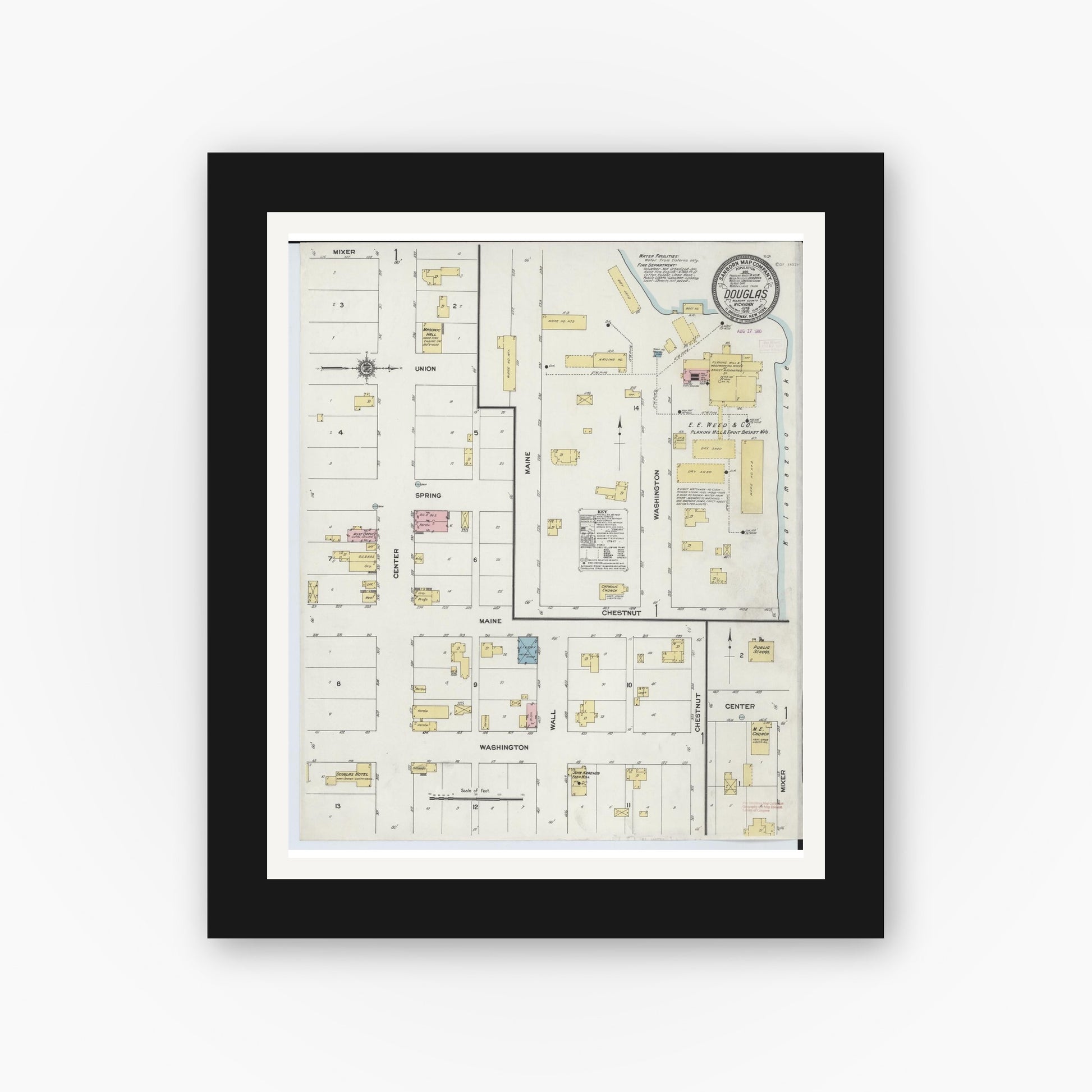 Old map wall art mockup — black gallery frame with white mat — Sanborn Fire Insurance Map from Douglas, Allegan County, Michigan (1910), Sheet #0001