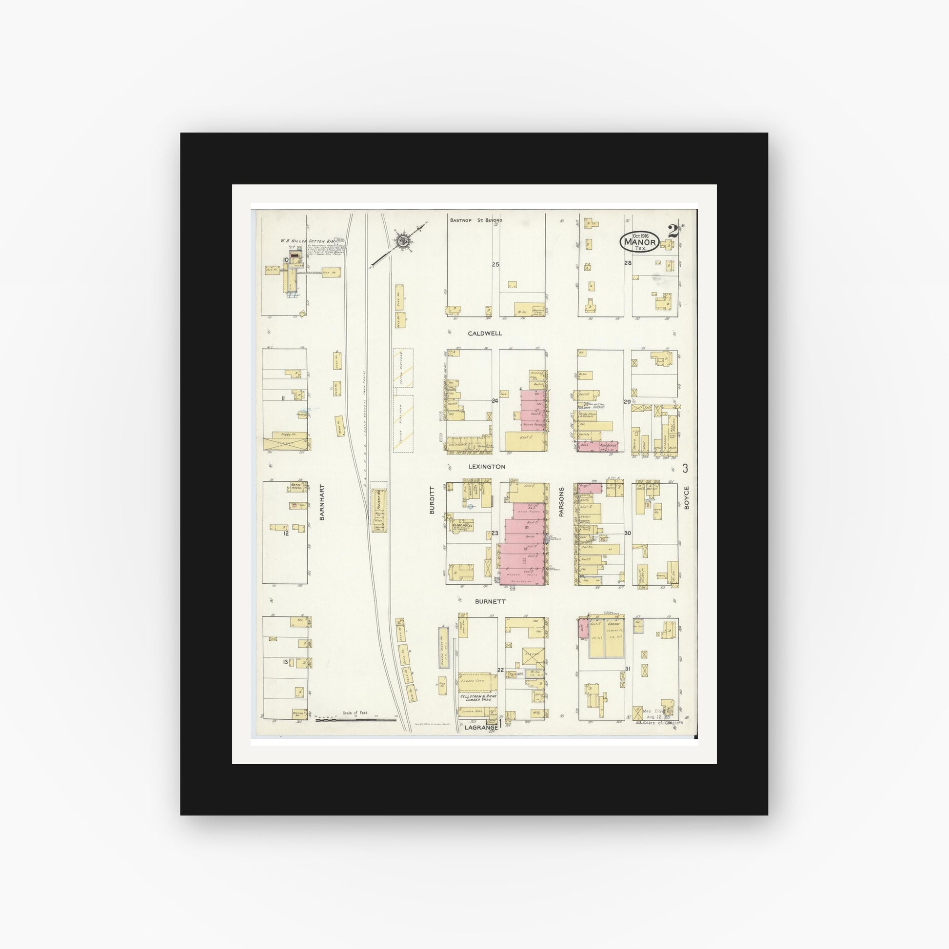 Old map wall art mockup — black gallery frame with white mat — Sanborn Fire Insurance Map from Manor, Travis County, Texas (1916), Sheet #0002