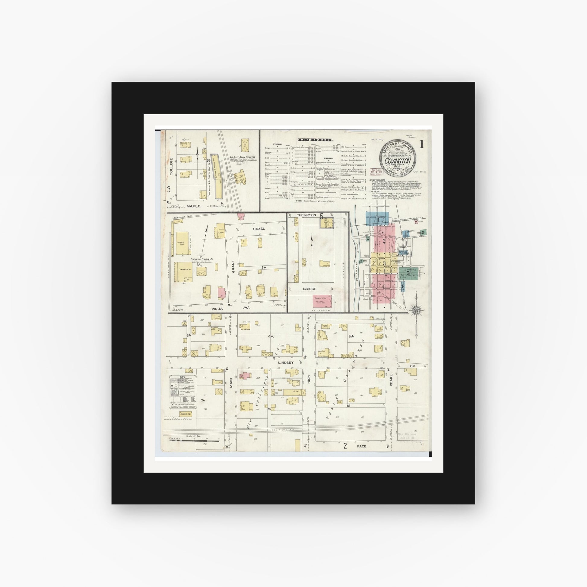 Old map wall art mockup — black gallery frame with white mat — Sanborn Fire Insurance Map from Covington, Miami County, Ohio (1910), Sheet #0001