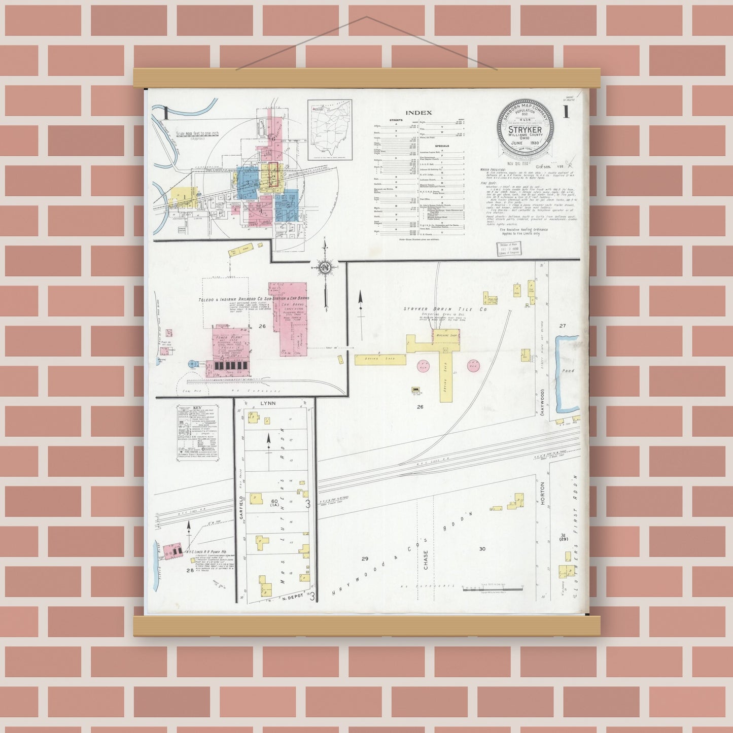 Old map wall art mockup — magnetic wood frame on brick wall — Sanborn Fire Insurance Map from Stryker, Williams County, Ohio (1930), Sheet #0001
