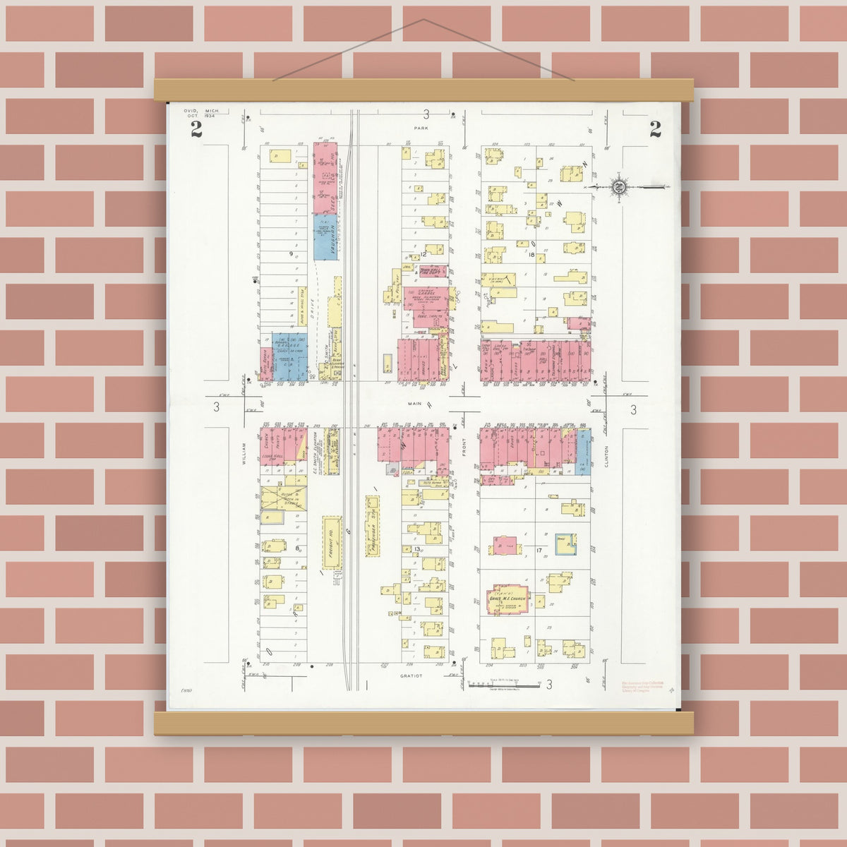 Old map wall art mockup — magnetic wood frame on brick wall — Sanborn Fire Insurance Map from Ovid, Clinton County, Michigan (1934), Sheet #0002